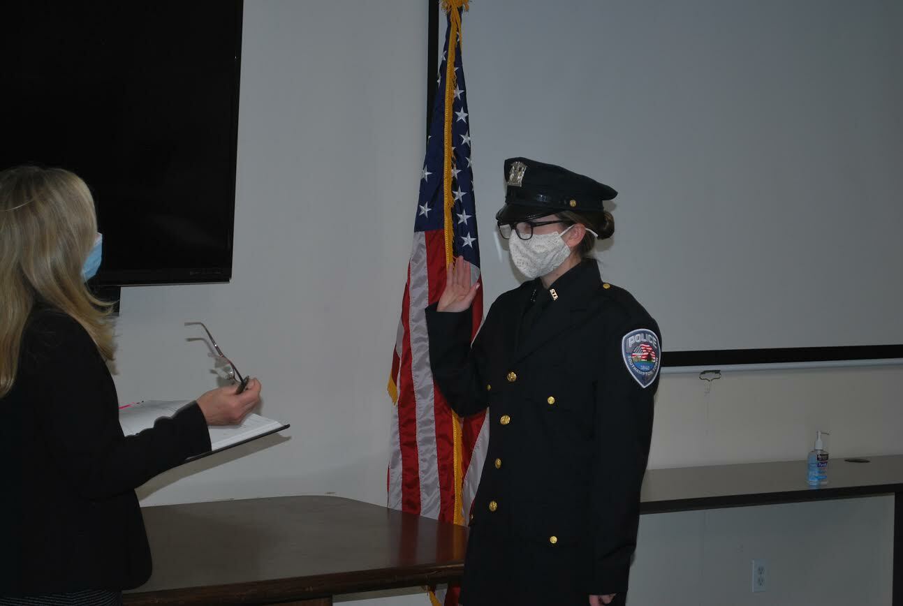 Madeline Sgange takes the oath of office, becoming one of the newest members of the Southampton Town Police Department. COURTESY STPD