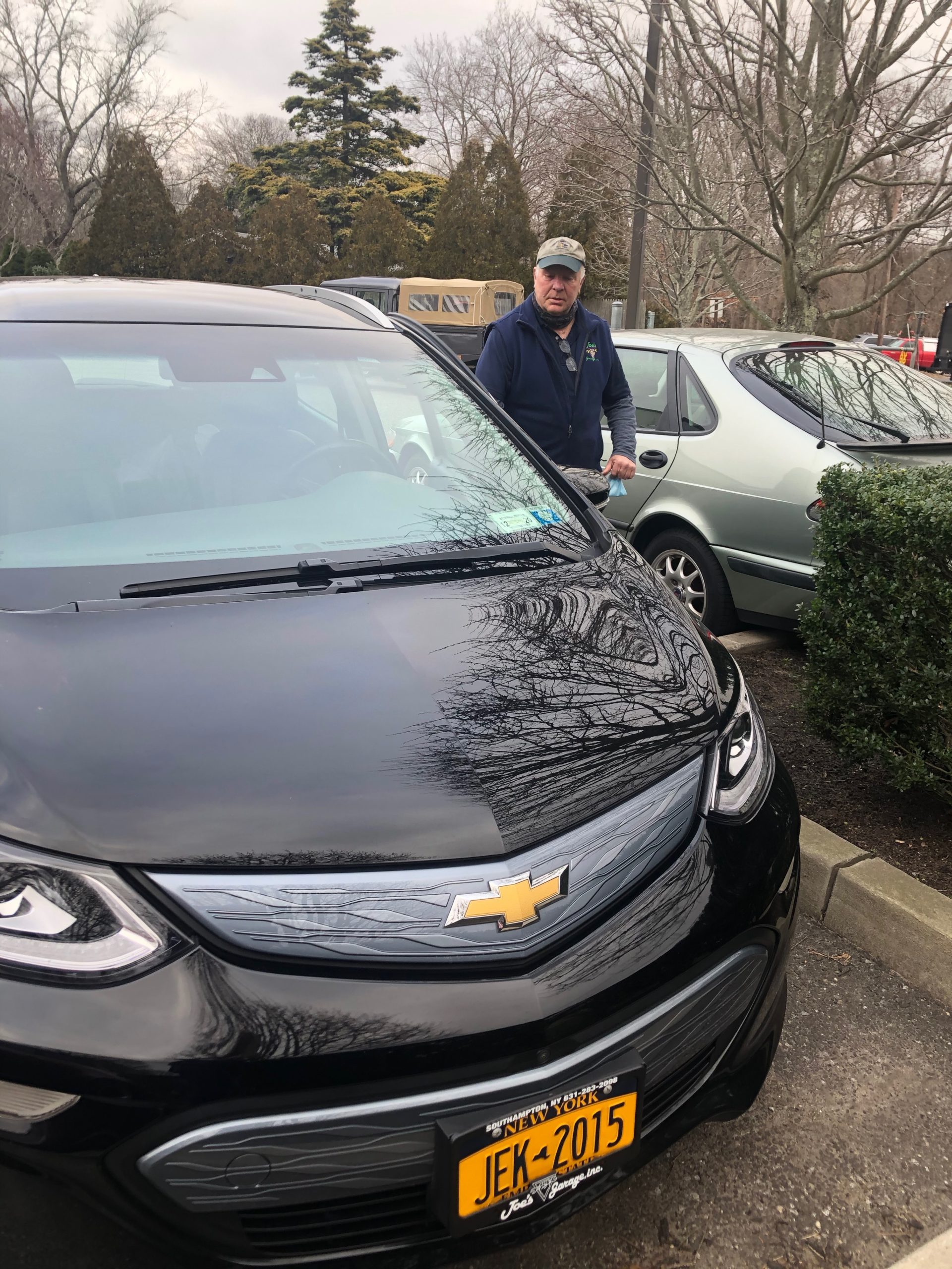 Joe Frizell of Joe’s Garage with his all electric Chevy Bolt.