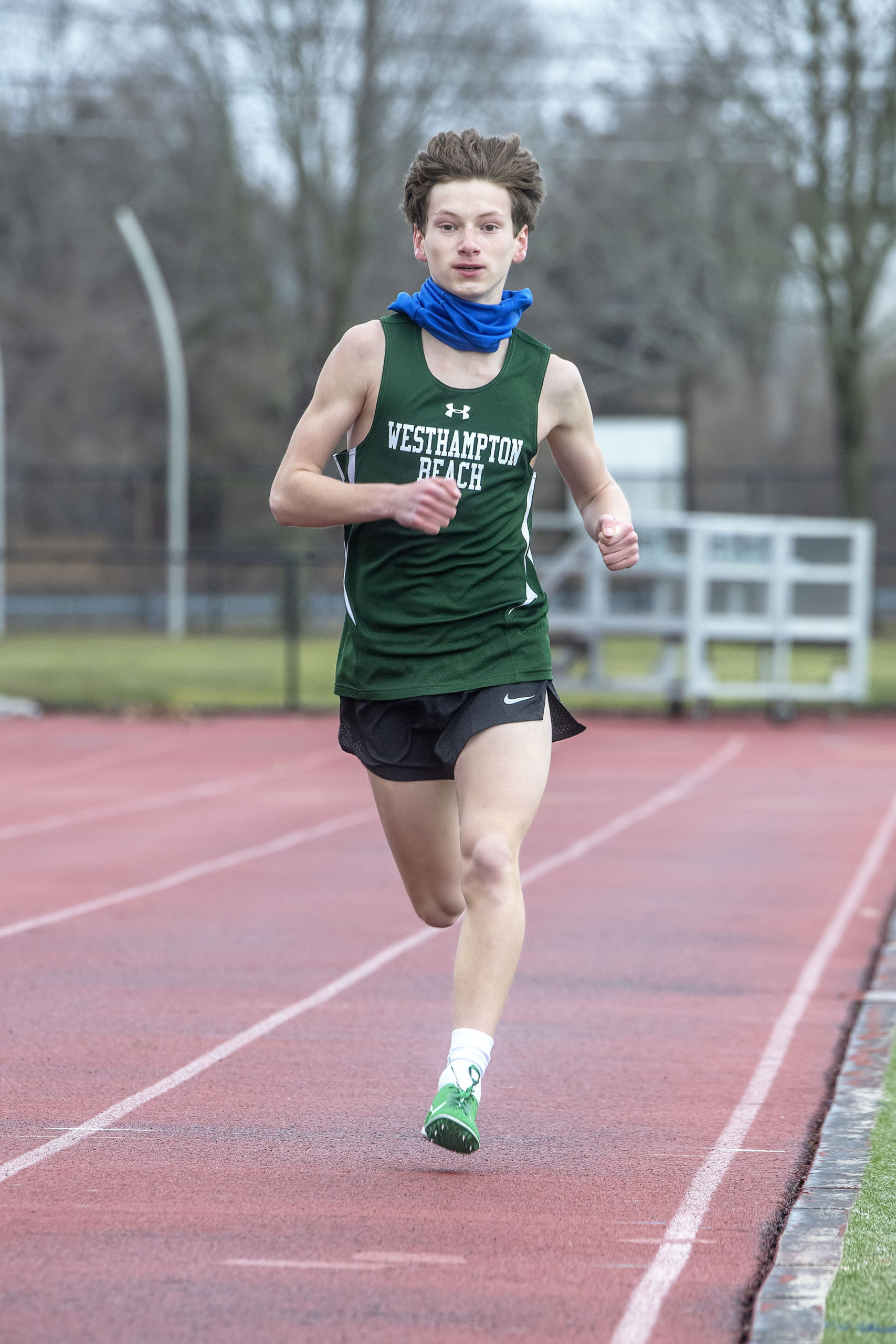 Distance runner Max Haynia as the Westhampton Beach boys track team competes against the team from Rocky Point at Westhampton Beach High School on Saturday.   MICHAEL HELLER