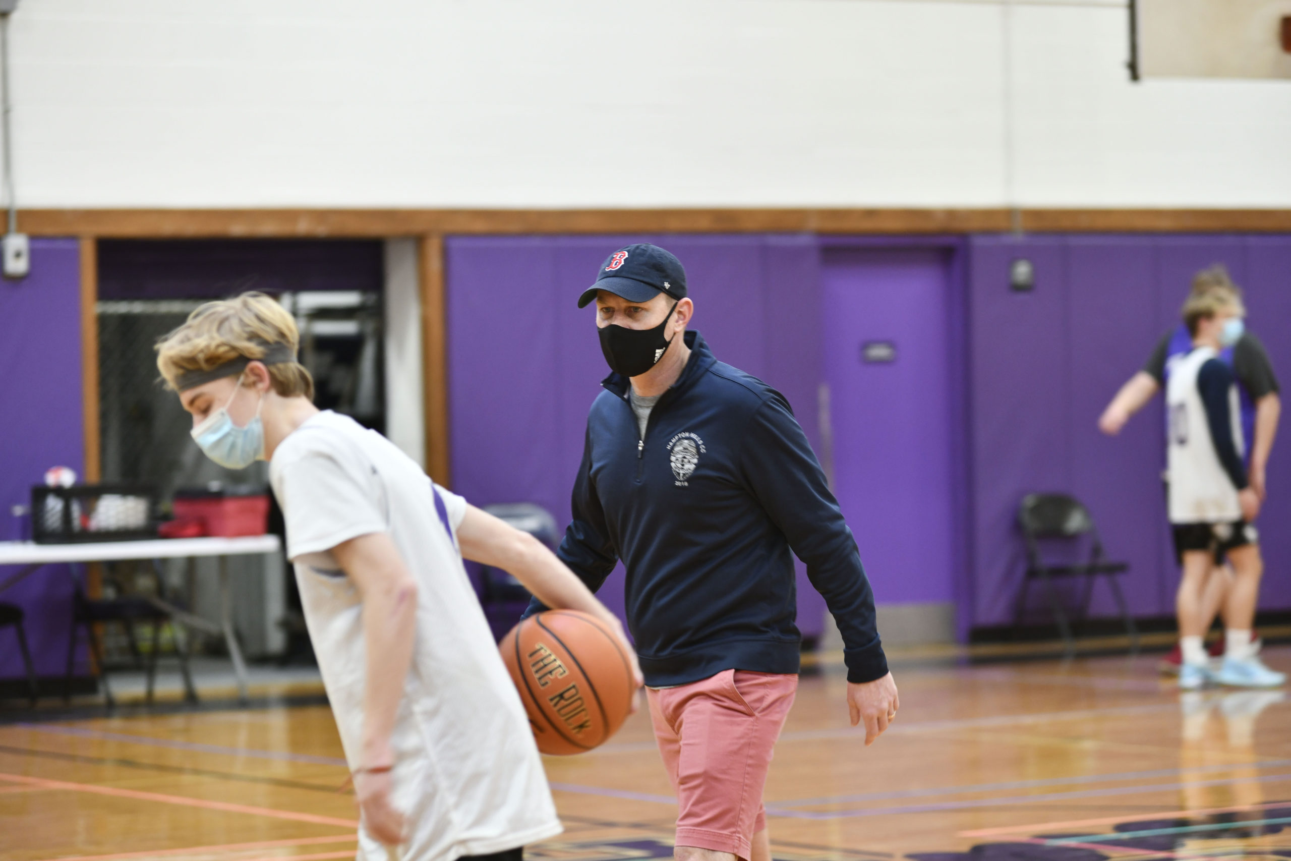 Noah Brown, the new head coach of the Hampton Bays Baymen basketball, team directs practice on Saturday morning.         DANA SHAW