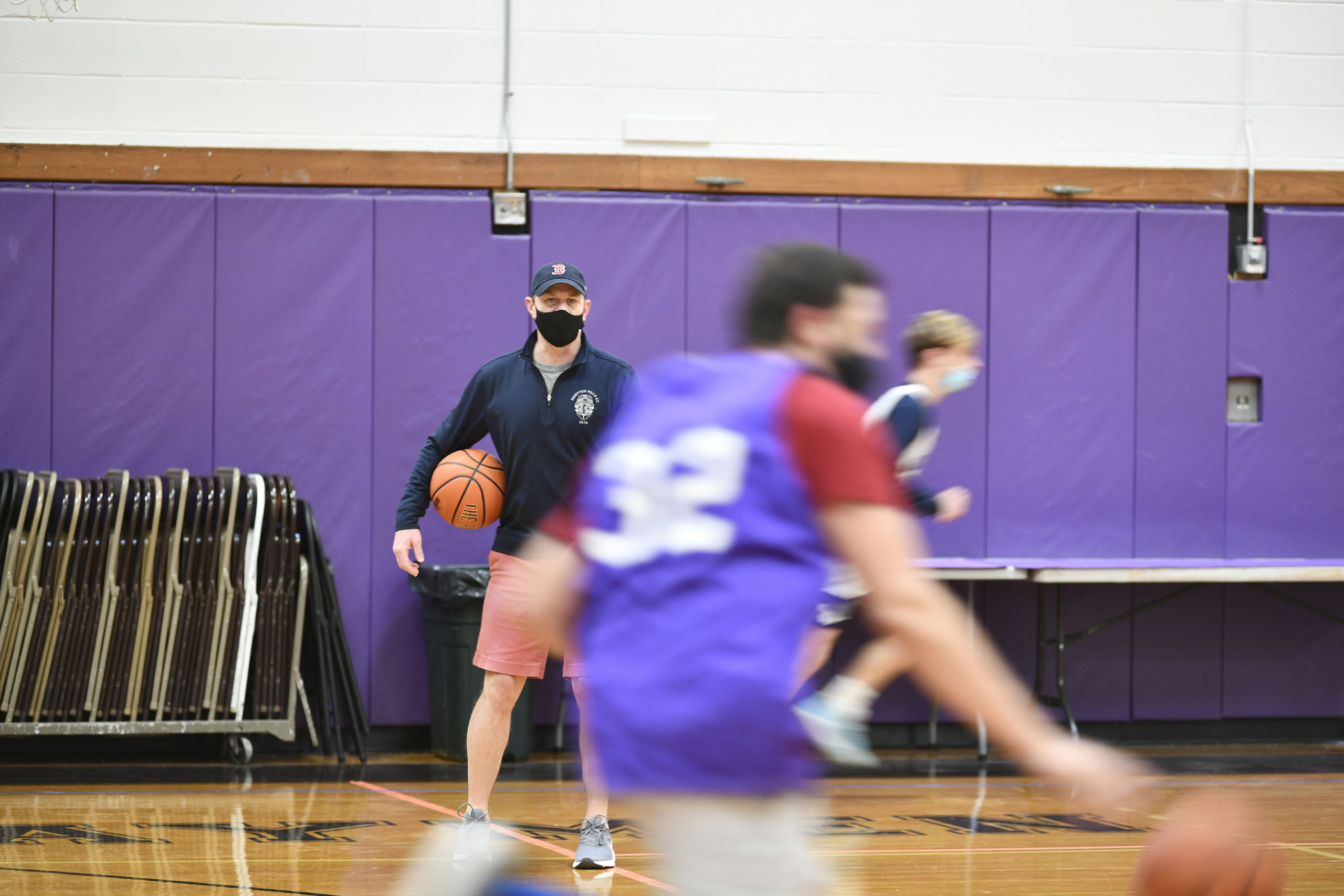 Noah Brown, the new head coach of the Hampton Bays Baymen basketball, team directs practice on Saturday morning.         DANA SHAW