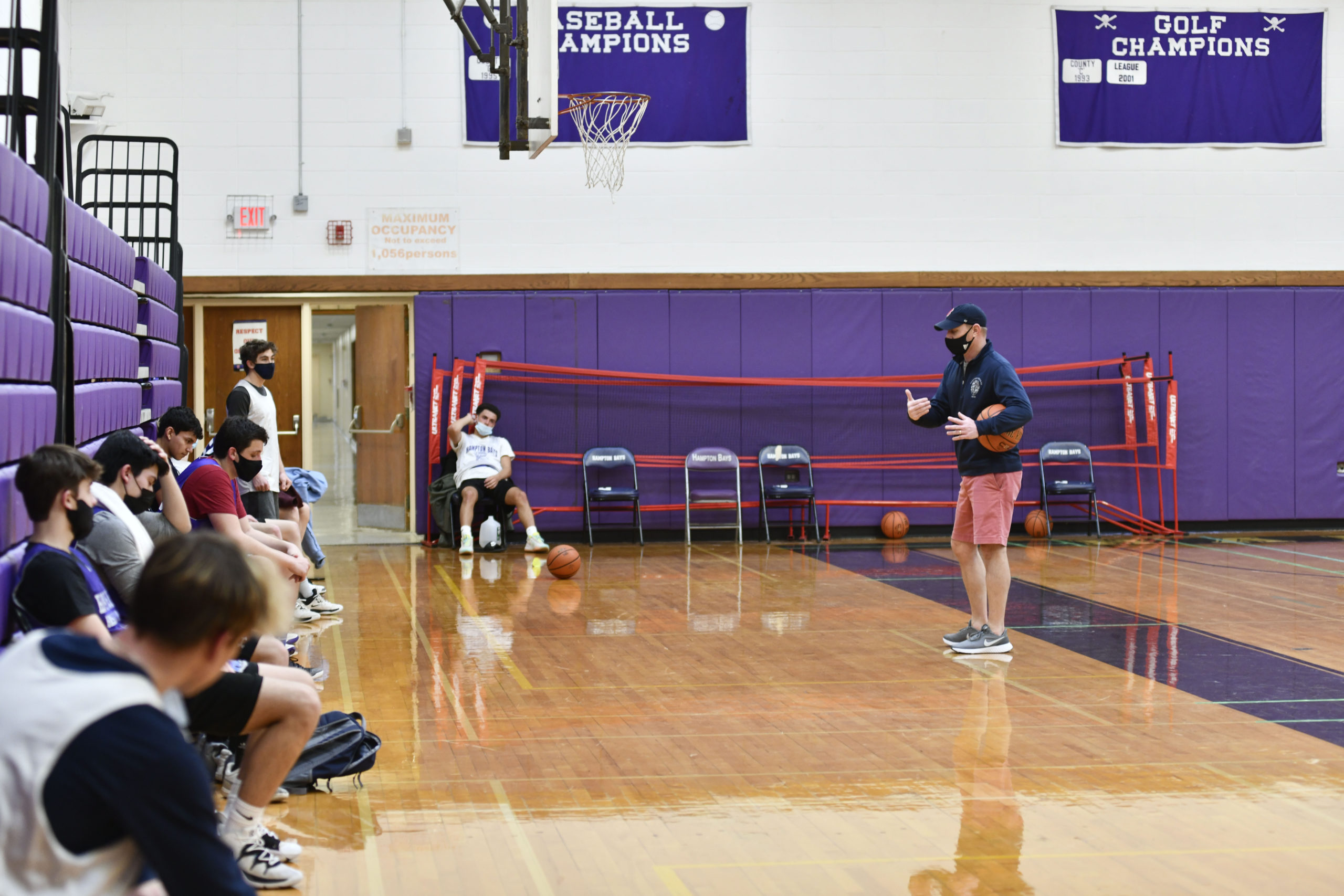 Noah Brown, the new head coach of the Hampton Bays Baymen basketball, team directs practice on Saturday morning.         DANA SHAW