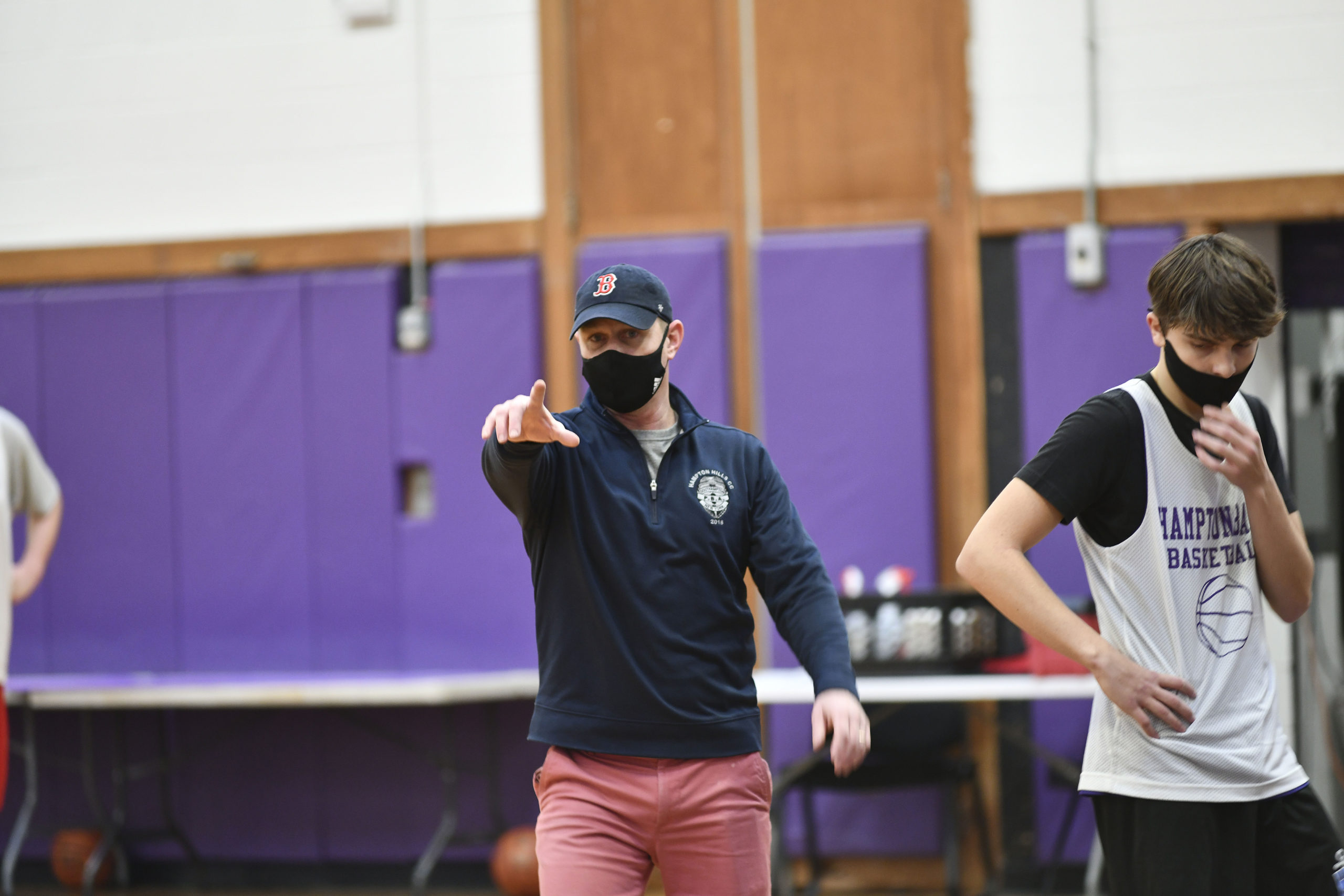 Noah Brown, the new head coach of the Hampton Bays Baymen basketball, team directs practice on Saturday morning.         DANA SHAW