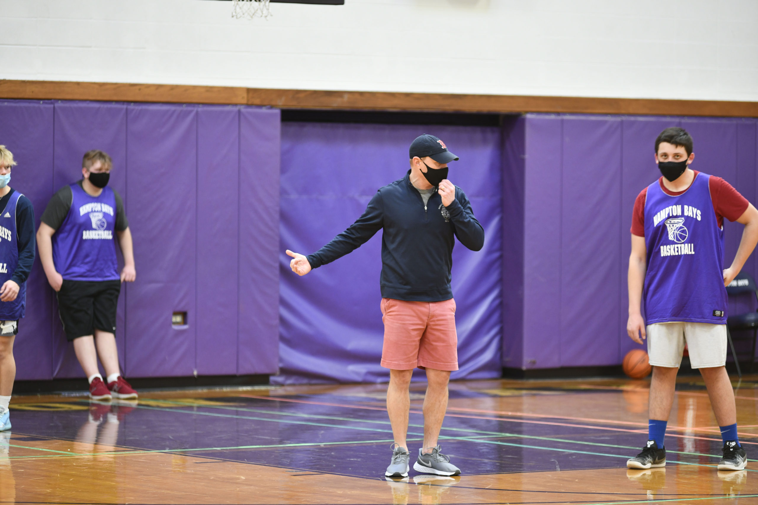 Noah Brown, the new head coach of the Hampton Bays Baymen basketball, team directs practice on Saturday morning.         DANA SHAW