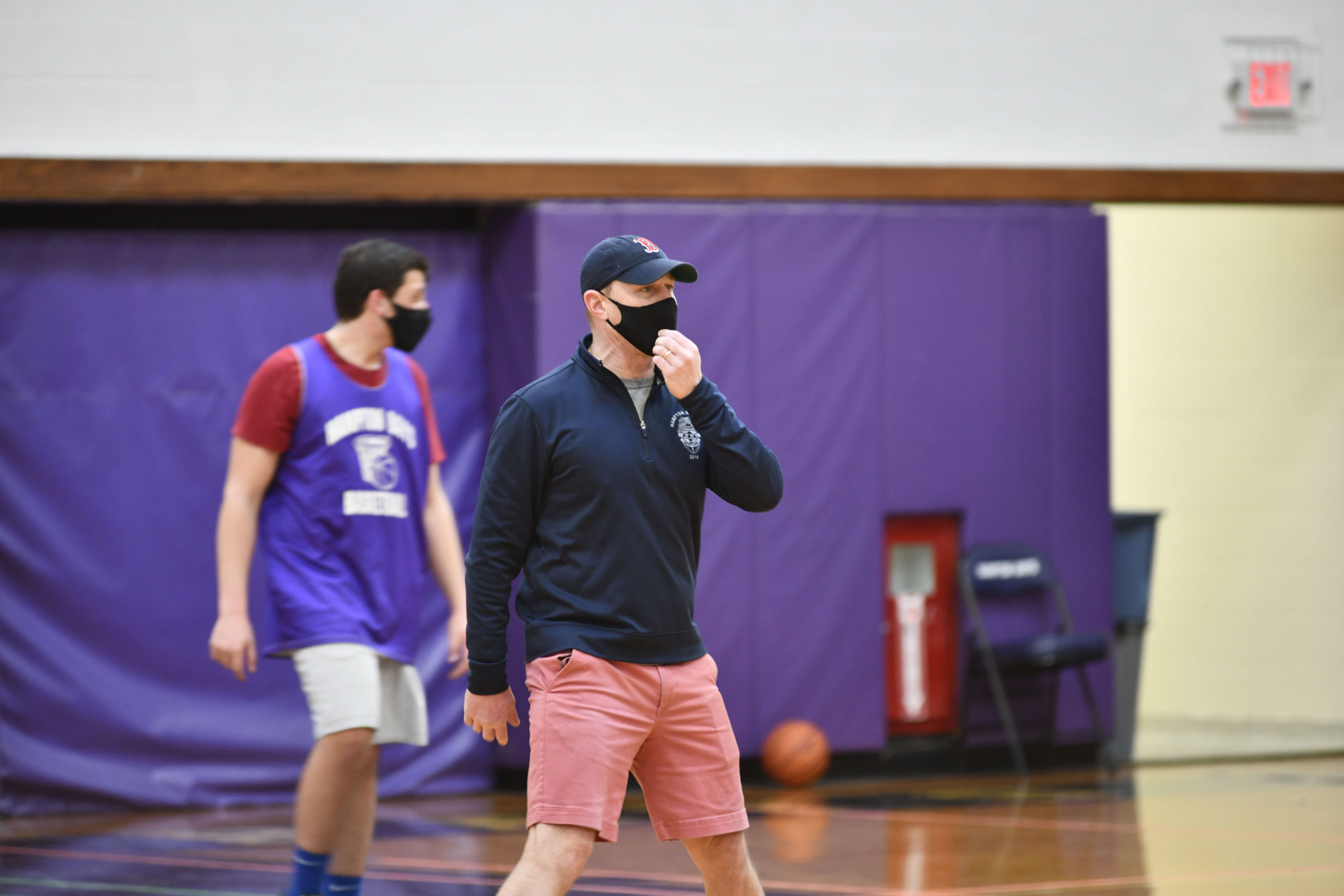 Noah Brown, the new head coach of the Hampton Bays Baymen basketball, team directs practice on Saturday morning.         DANA SHAW