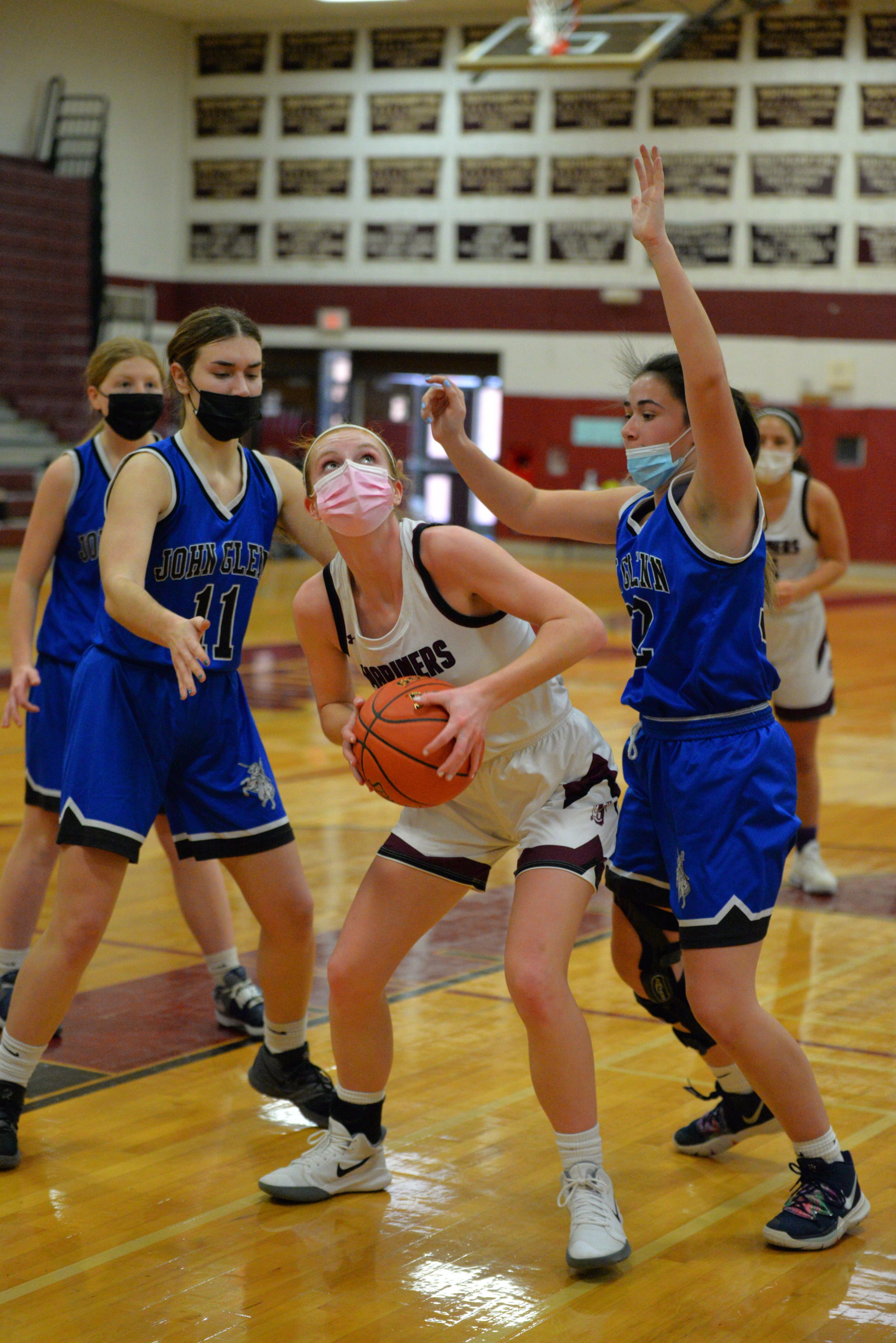 Lady Mariner Carly Cameron looks to go up for two points against Elwood/John Glenn defenders.