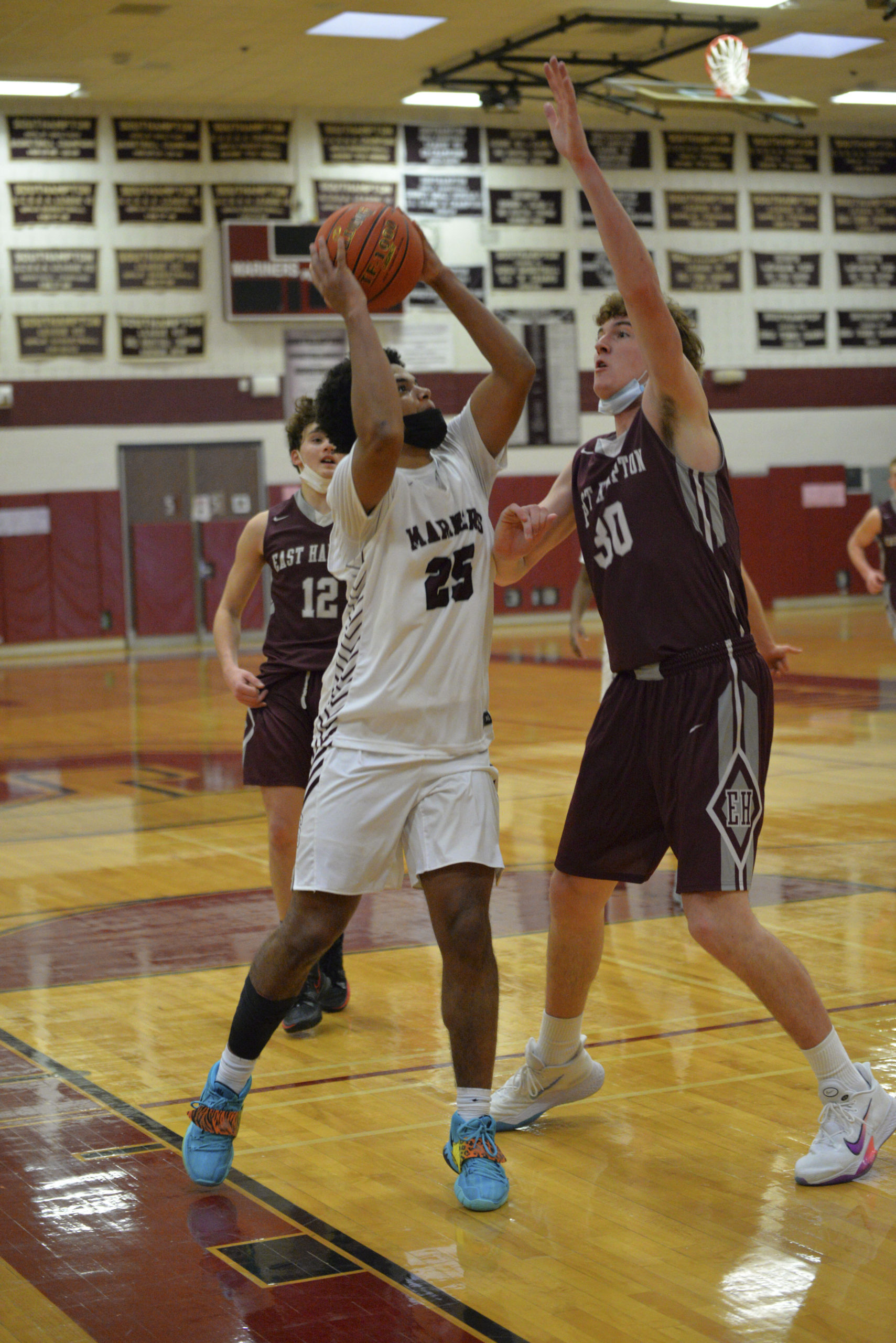 LeBron Napier goes up against East Hampton's  Charlie Condon.                MICHELLE MALONE
