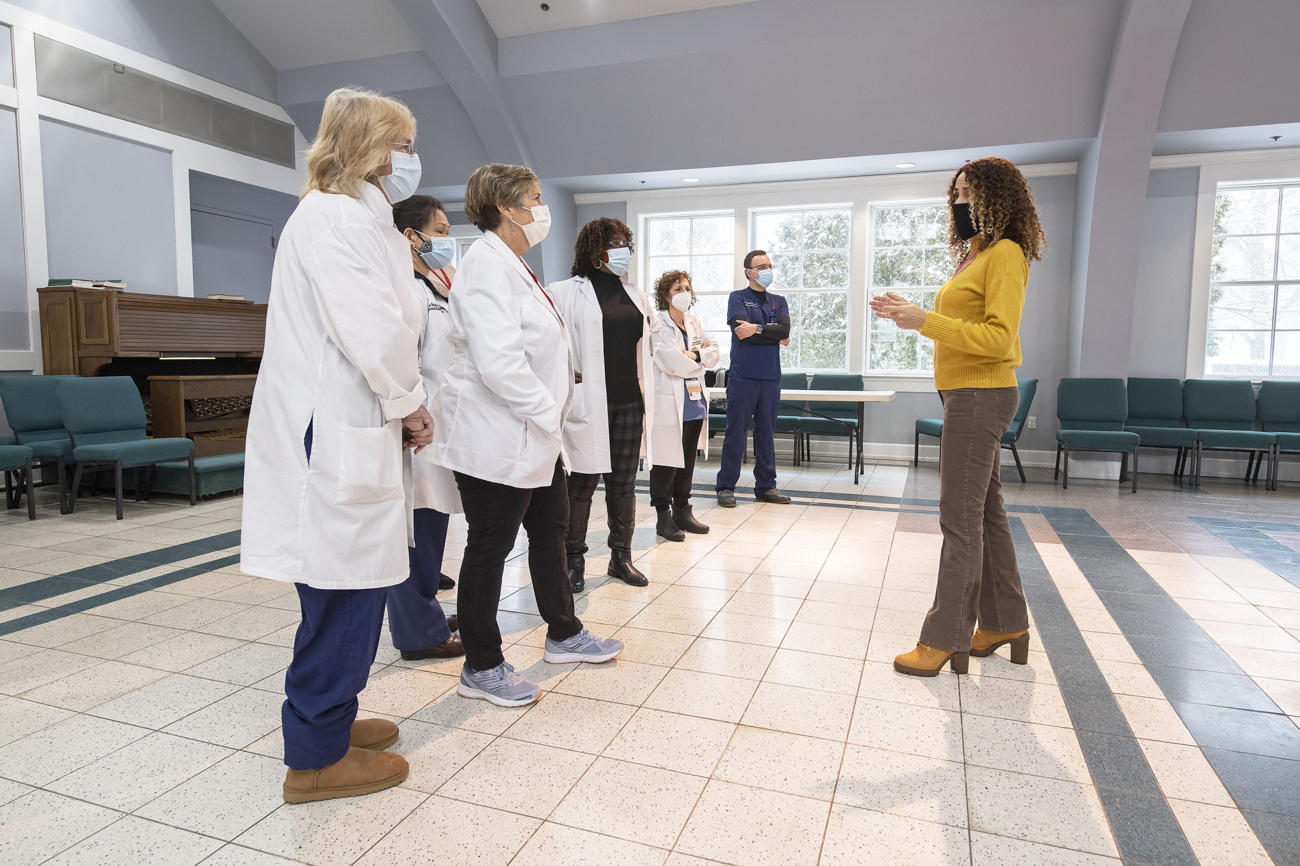 OLA  (Organización Latino-Americana) Executive Director Minerva Perez consults with Stony Brook Hospital nursing staff prior to the opening of a COVID-19 vaccine POD (Pop Up Dispensary) in the Ryan Dempsey Parrish Hall of the Most Holy Trinity Church in East Hampton on Friday.       MICHAEL HELLER
