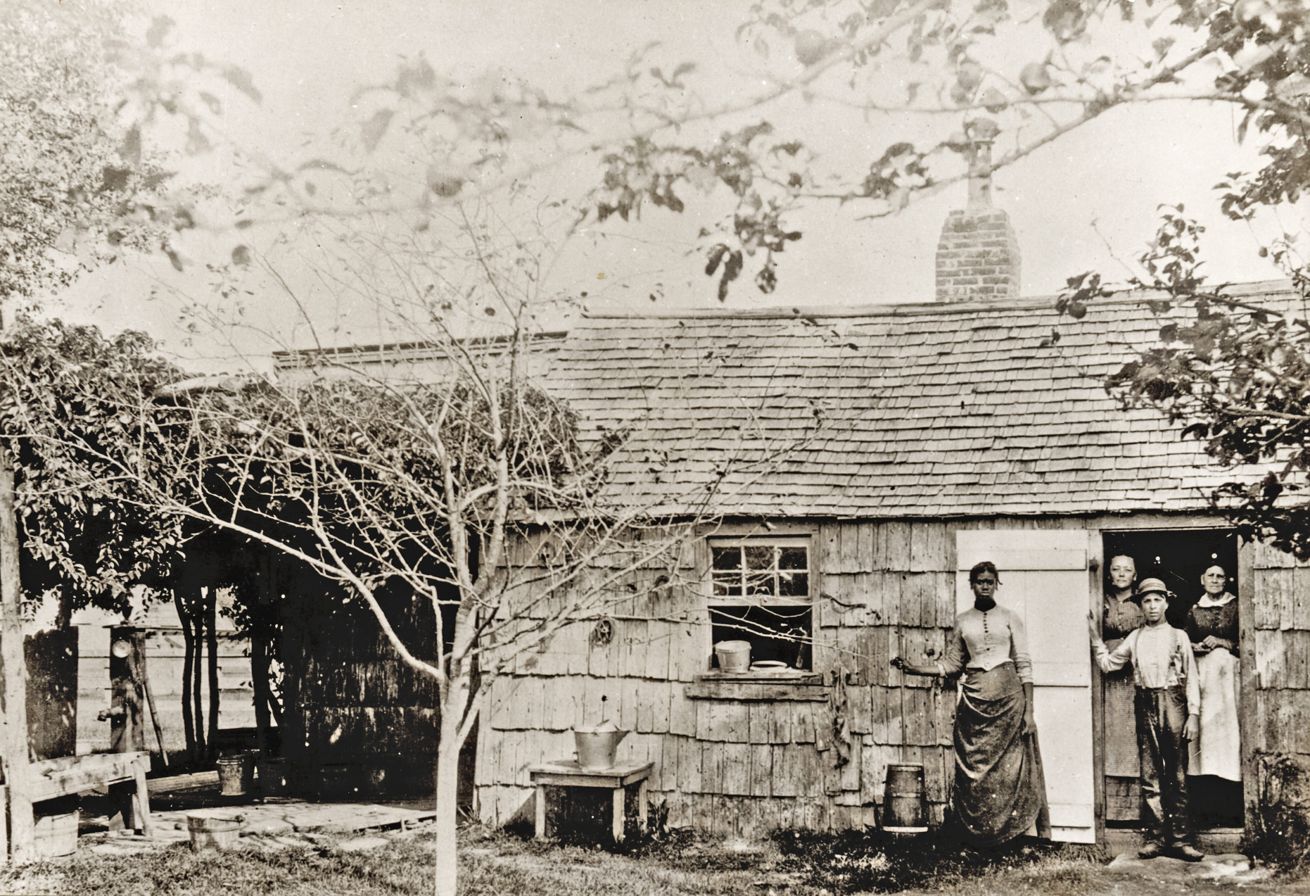 The Stratton Dayton house was in East Hampton, in the present-day Village of East Hampton. The date of this 19th century photograph and the names of the people in it are not known.   Courtesy Plain Sight Project