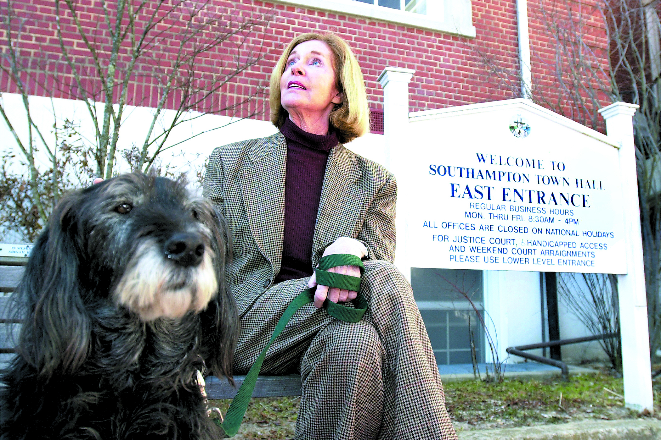 Pat Lynch with her dog, Mr. Ben, at Southampton Town Hall.   DANA SHAW