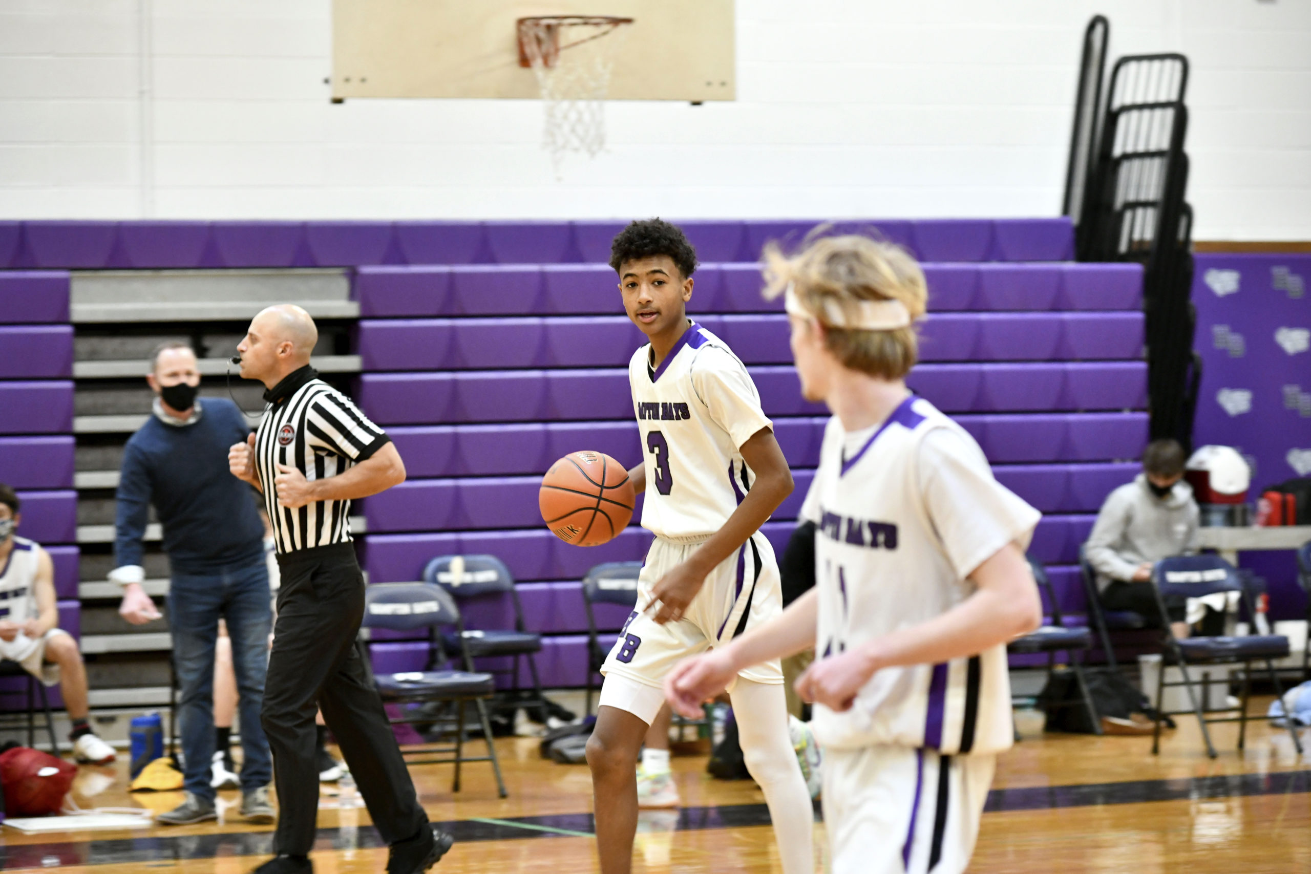 Hampton Bays sophomore Kazmir Johnson communicates a play to senior Jack McNamara. DANA SHAW