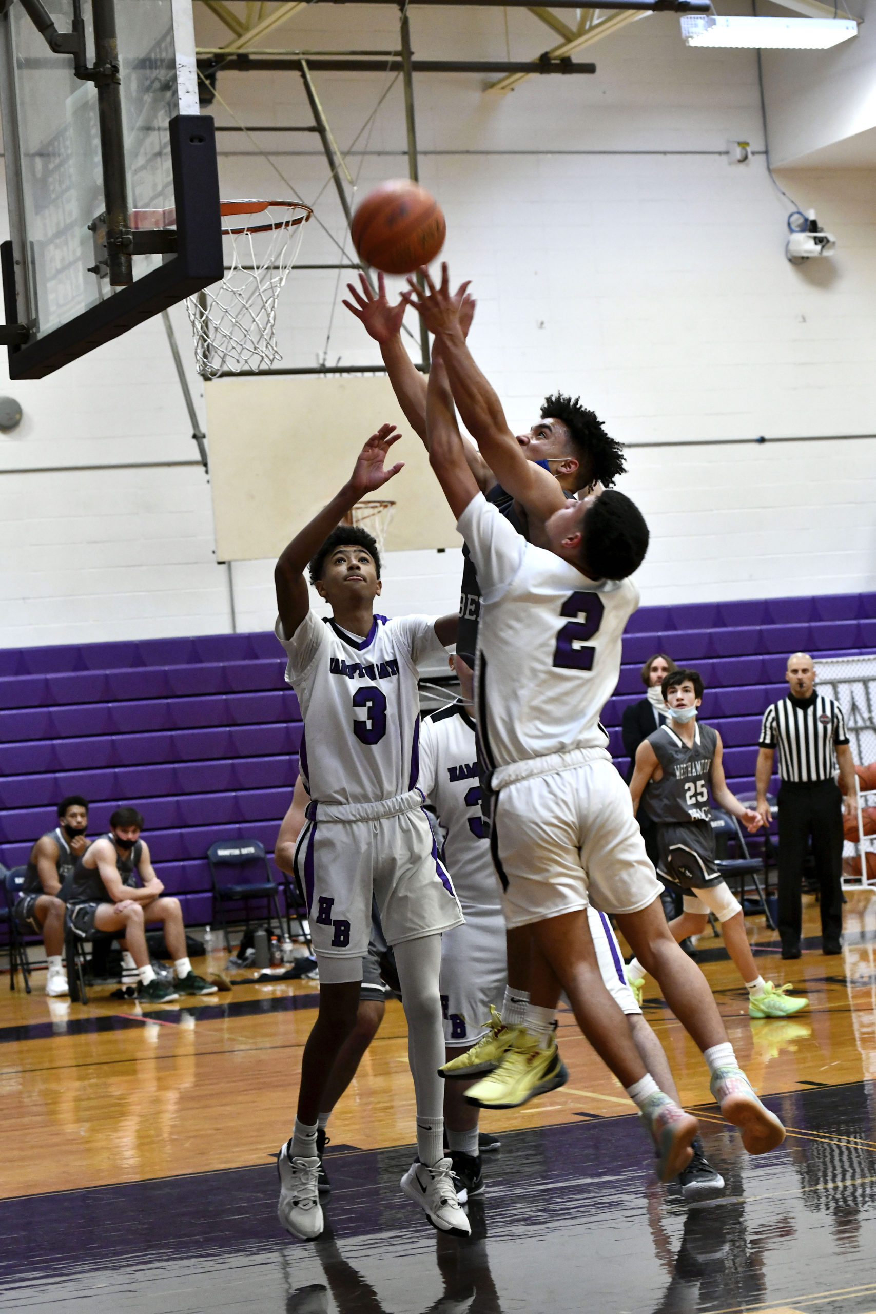 Westhampton Beach senior Justice Goode shoots between Kazmin Johnson, Isaiah Lattanzio and Nick Alvarez.   DANA SHAW