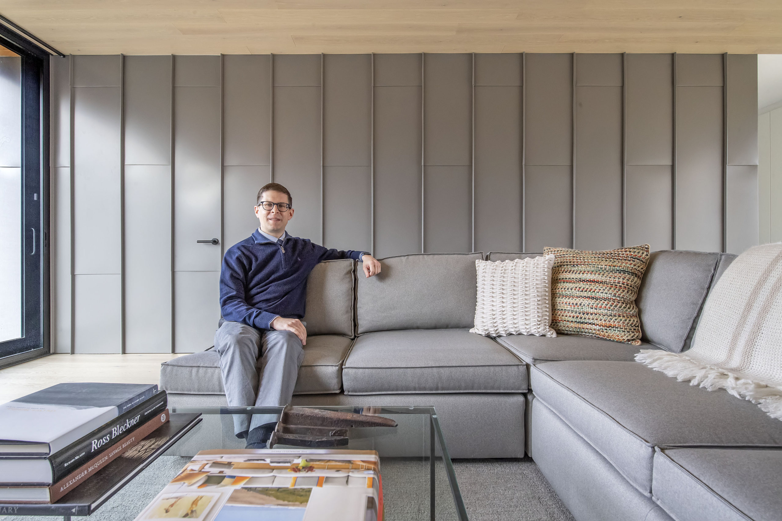 Architect Aaron Zalneraitis in the living room of the East Hampton home he designed for himself.