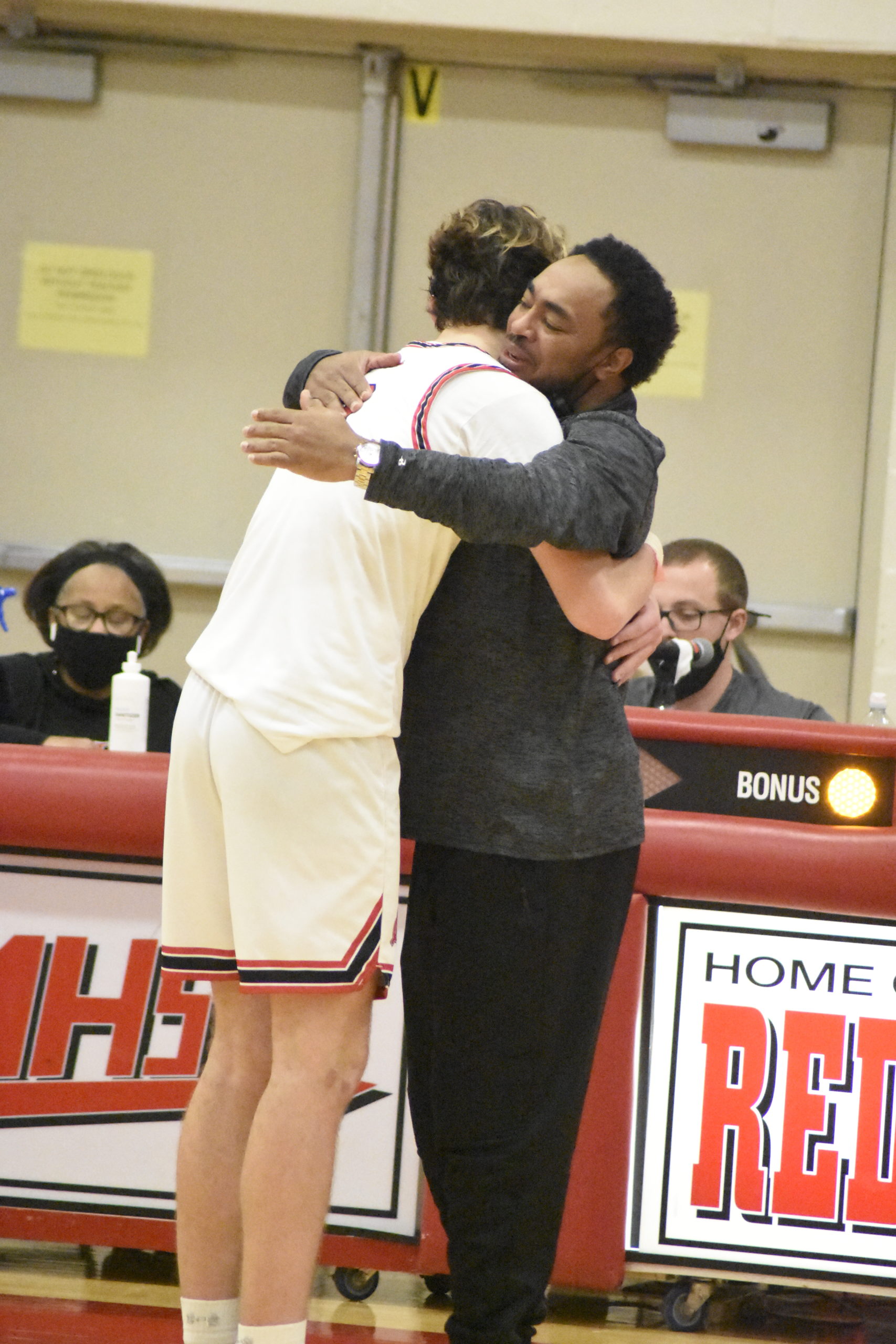 Nick Thomas and senior Jordan Falco hug each other in the waning minutes of Sunday's Conference IV Championship.