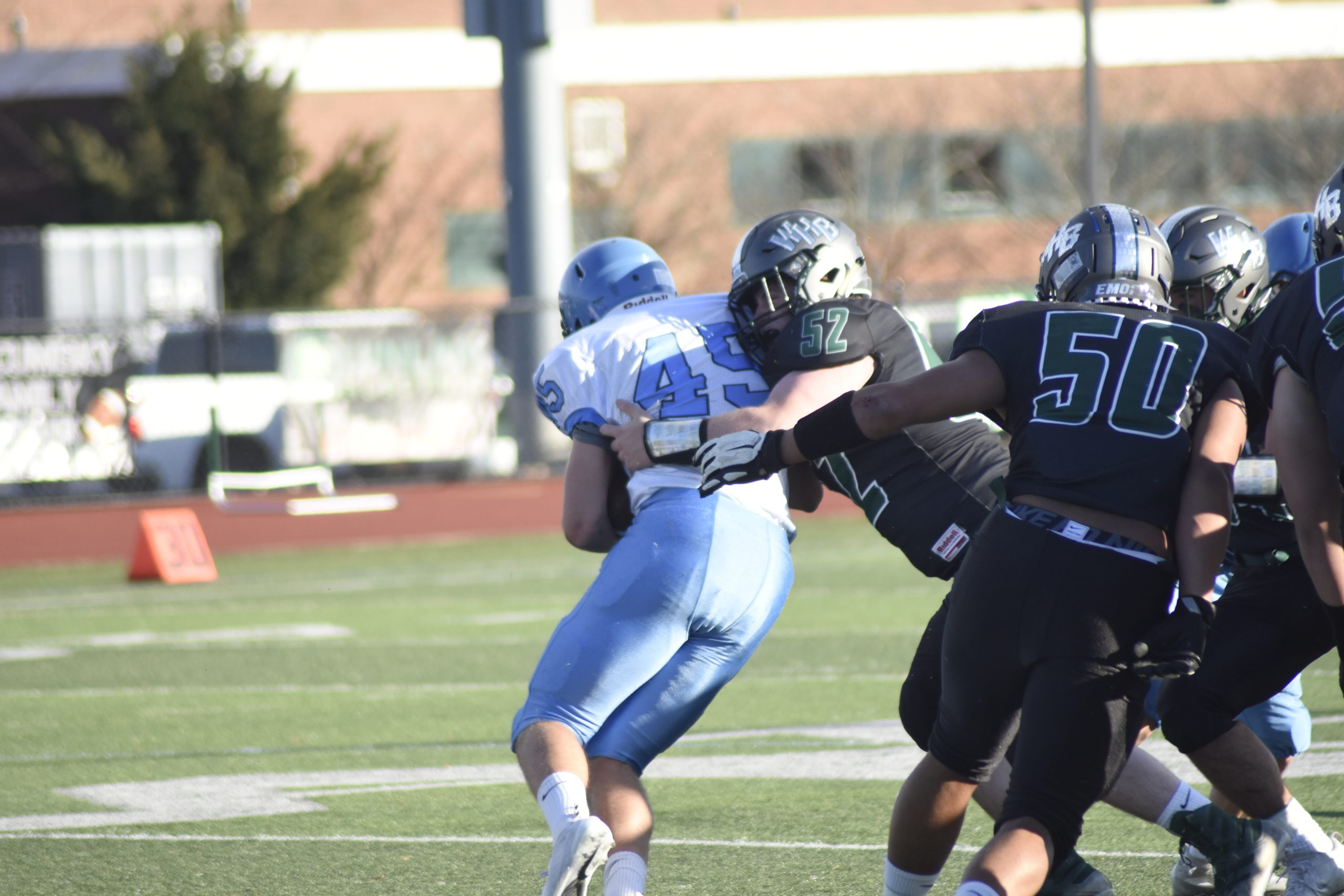 Jake Mecca of Westhampton Beach tackles a Rocky Point player.