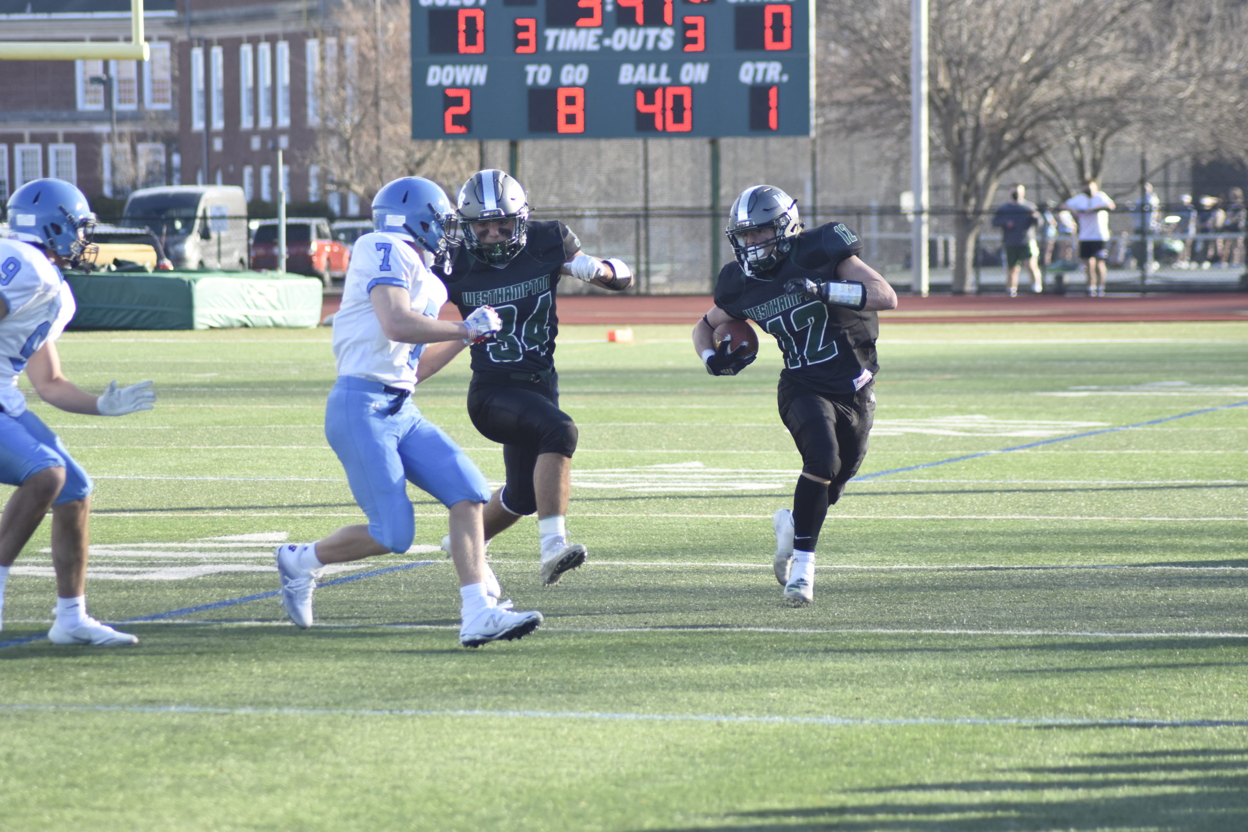 Aidan Cassara (12) gets a lead block from Dom Sarno.