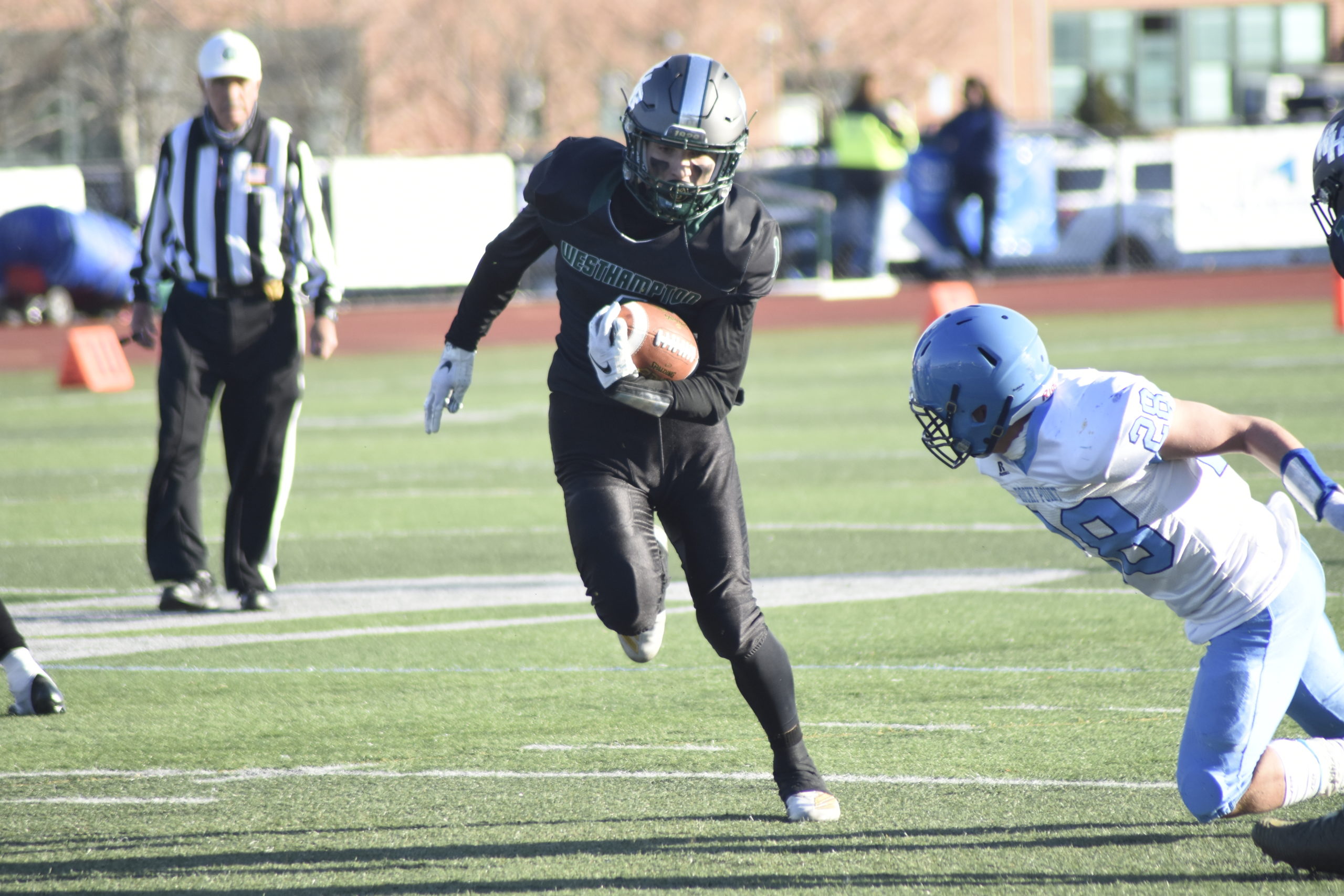 Deegan Laube looks for some open space after intercepting a Rocky Point pass.