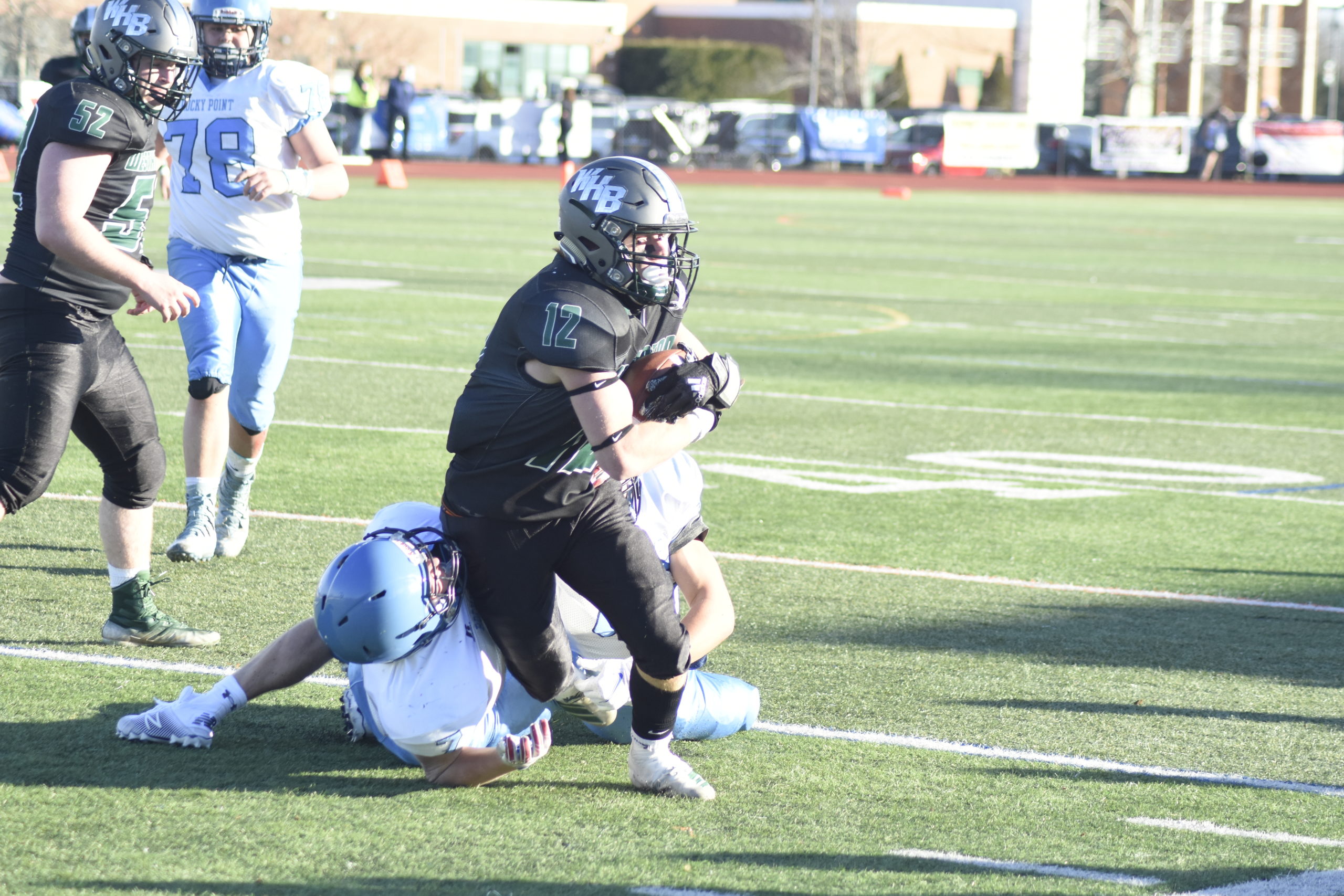 Westhampton Beach co-captain Aidan Cassara lunges forward for some extra yards.