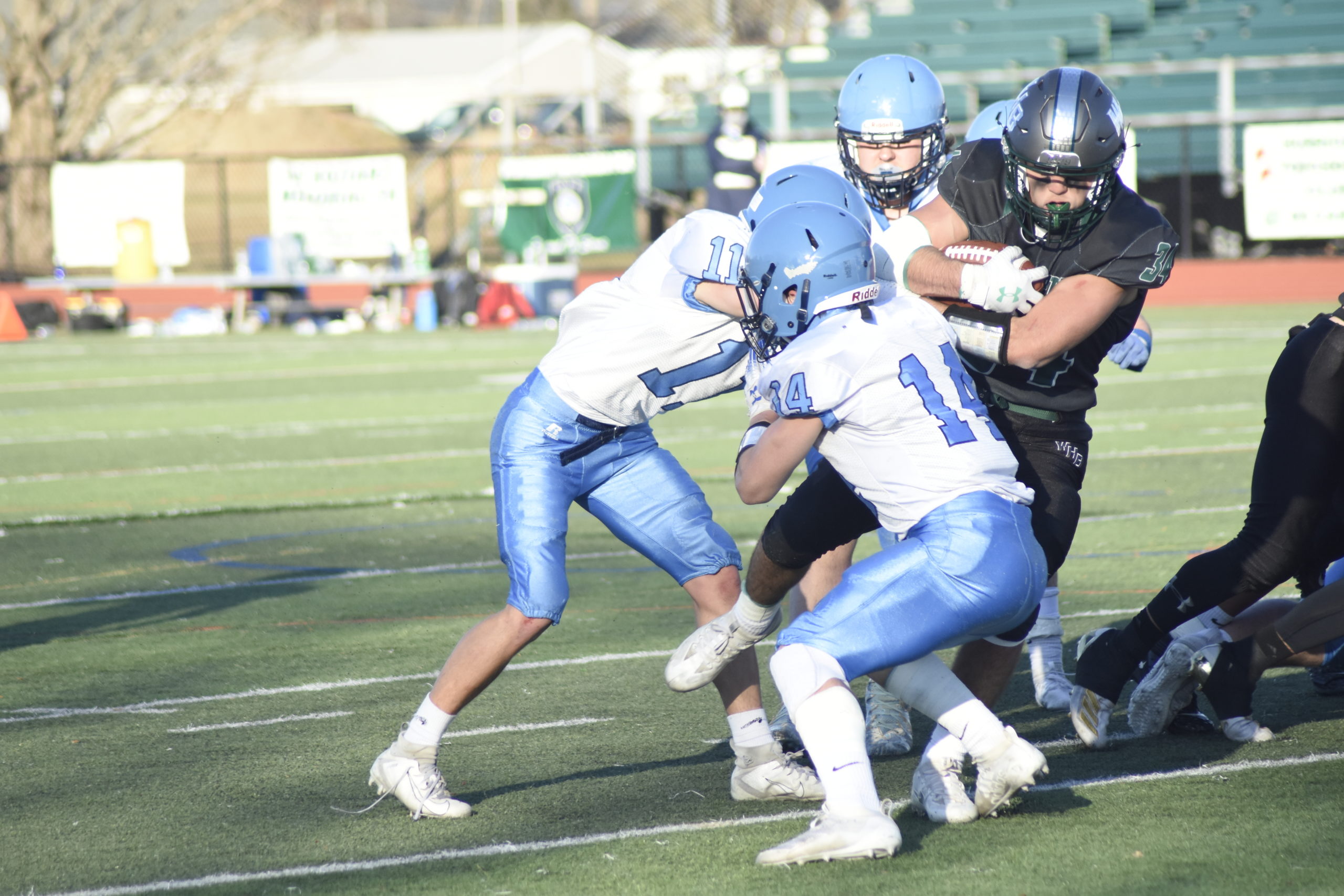 Dom Sarno takes on multiple Rocky Point defenders but has more than enough to cross the goal line for the Hurricanes first touchdown of the season.