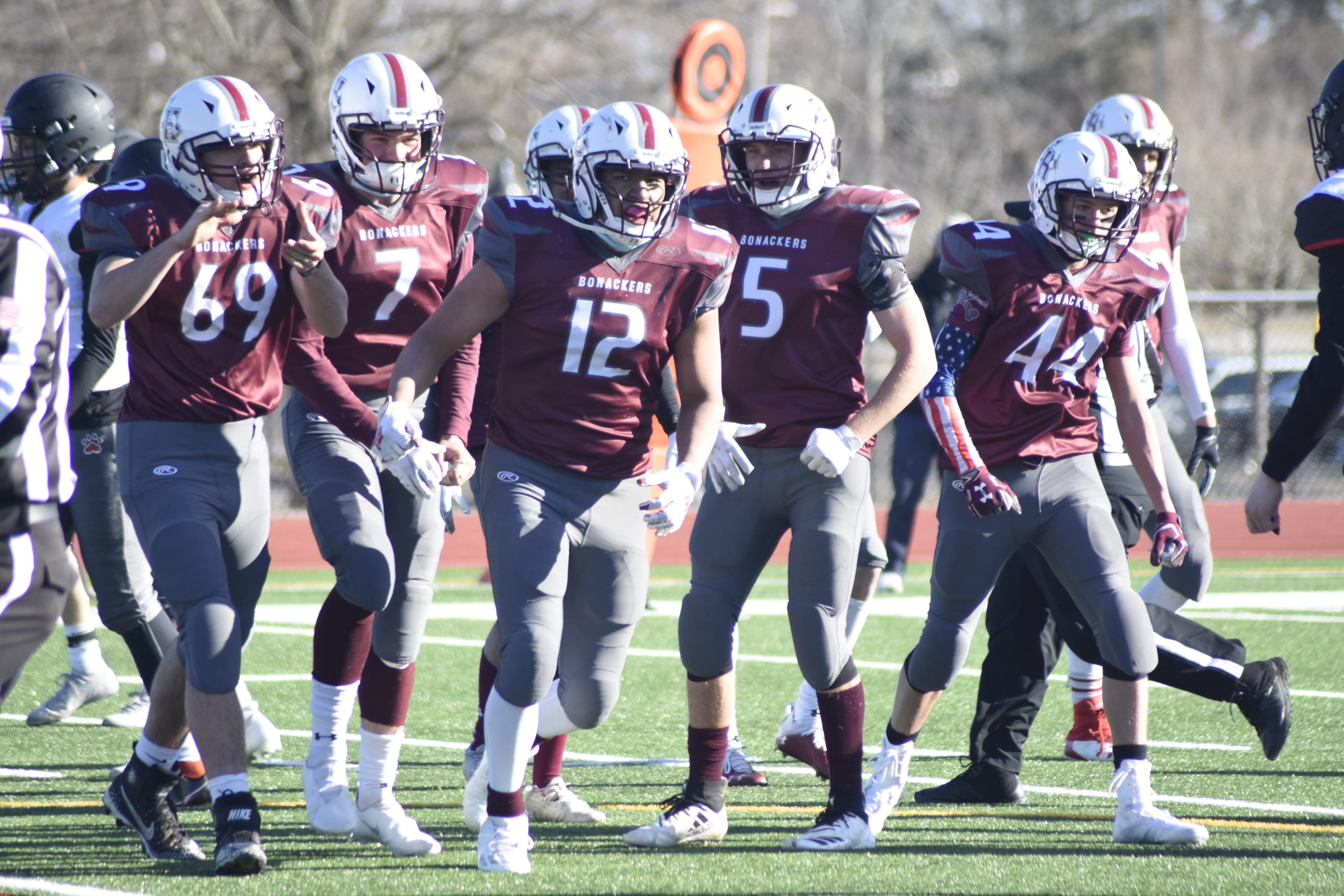 Senior quarterback Topher Cullen attempts a pass on the Bonackers first drive of the season.|Richard Barranco and the rest of his Bonac teammates are pumped up after his big stop on a fourth down attempt by Babylon.  DREW BUDD