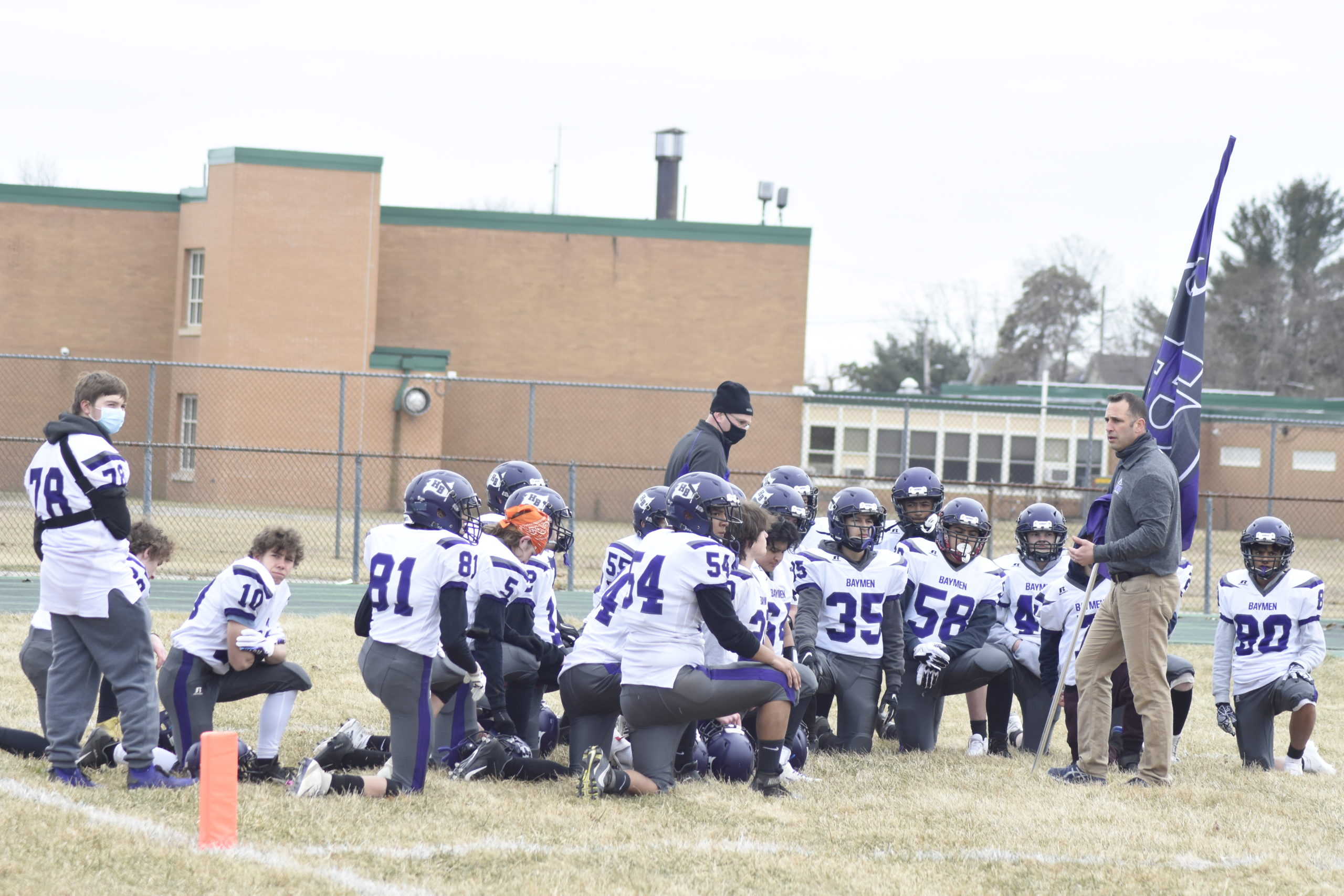 Hampton Bays head coach Rich Doulos rallies his team just before kickoff at Wyandanch on Wednesday.