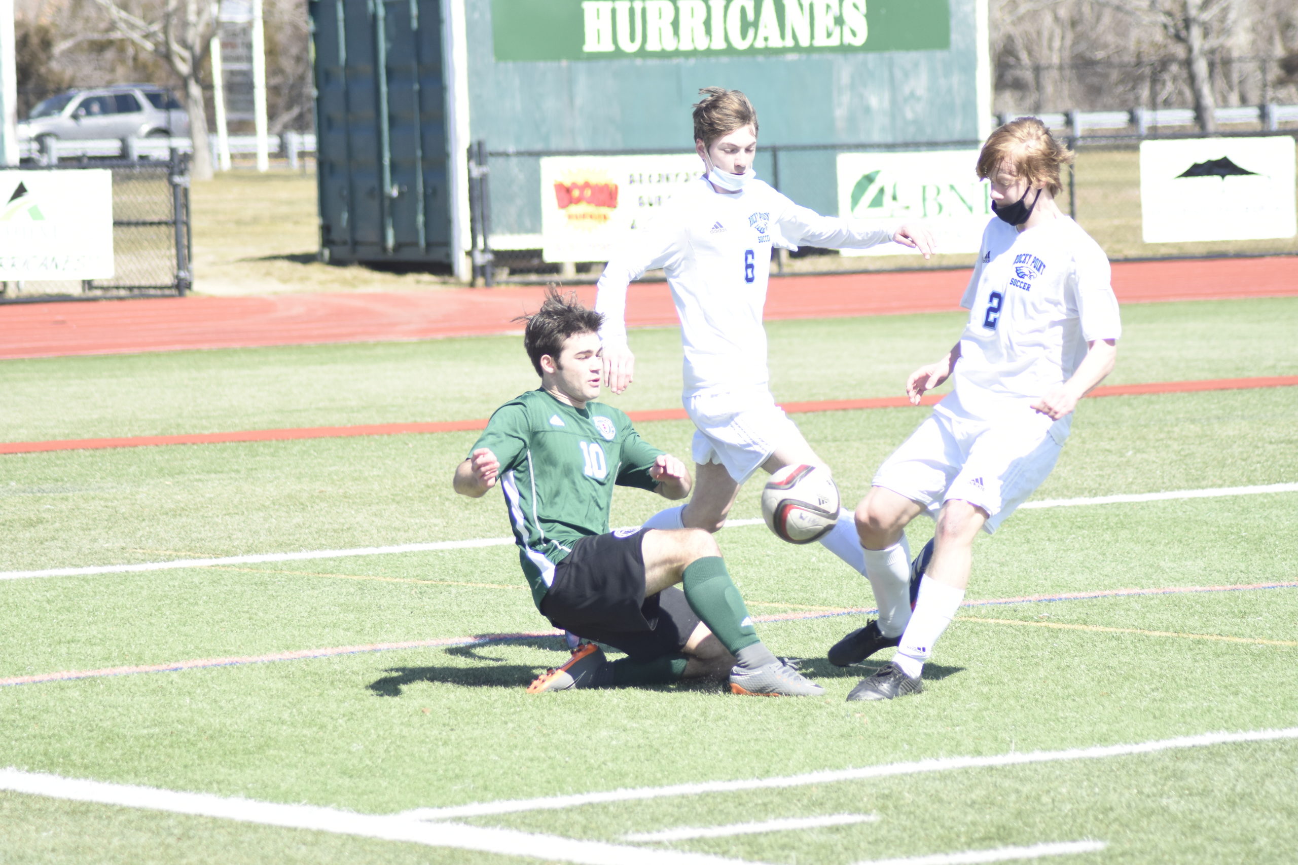 Westhampton Beach senior Dillon Canavan slides to try and keep the ball in the box.