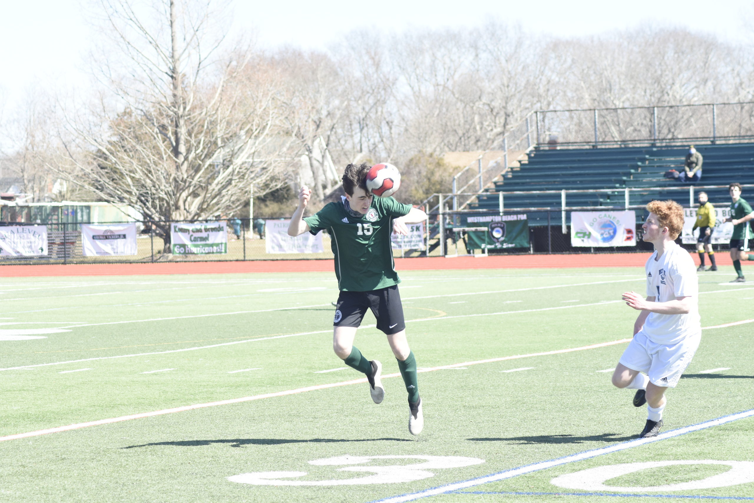 Westhampton Beach junior Aidan Kellachan heads the ball.