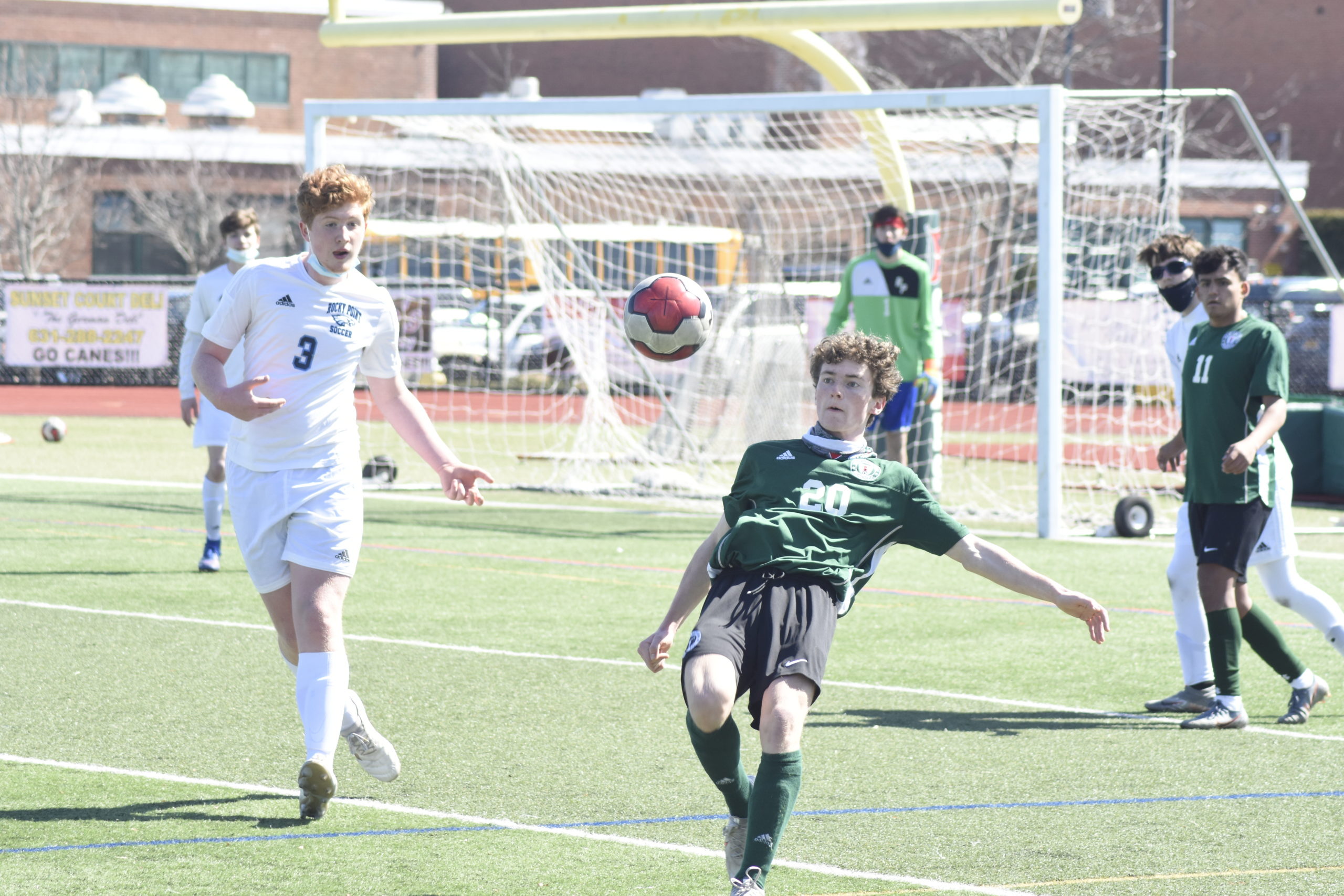 Westhampton Beach sophomore Ethan Vogt gets set to kick the ball backwards into Rocky Point's defensive end.
