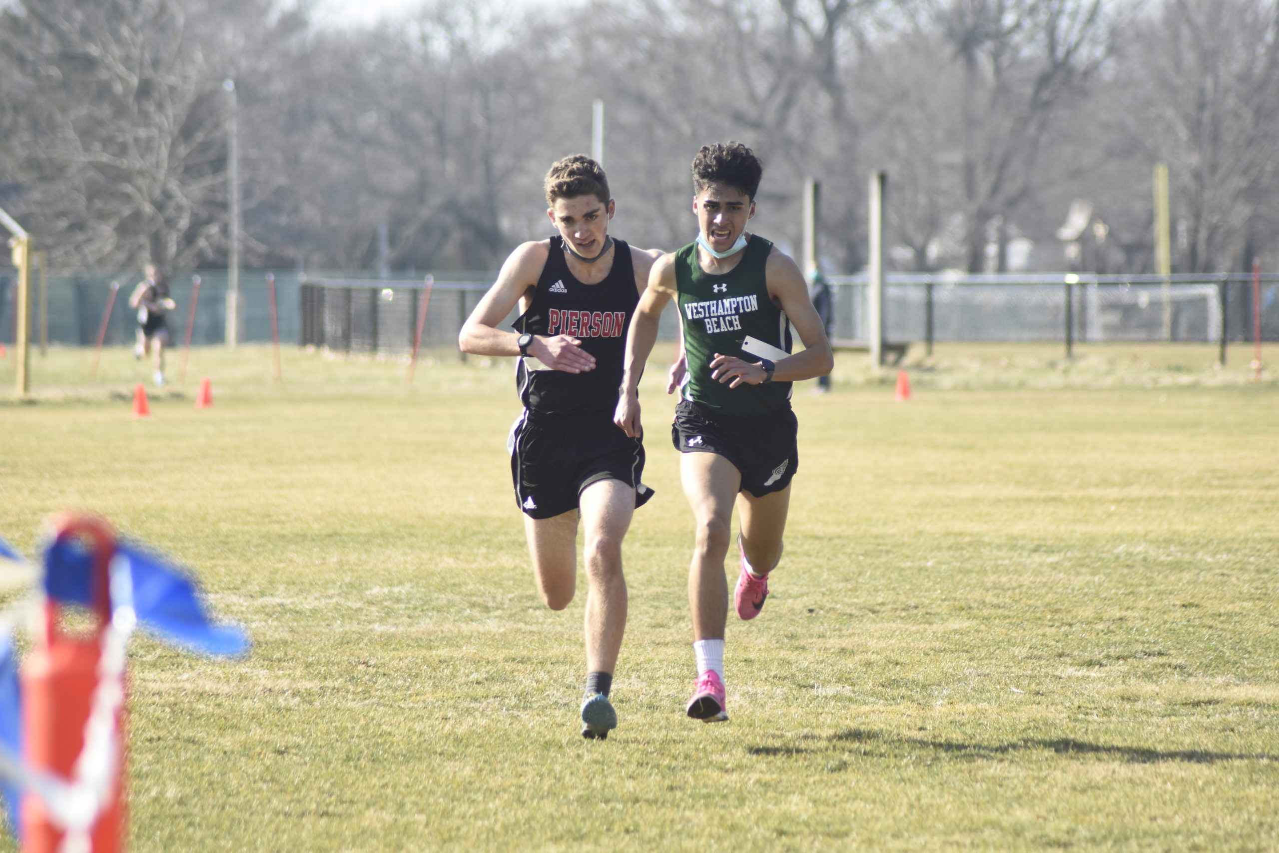 Pierson's Penelope Greene and Jackie Amato of Westhampton Beach were among the first group of runners.|Pierson senior Penelope Greene won the girls race in 17:44.21.|Pierson's P.J. Ramundo and Danny Alvarado of Westhampton Beach race toward the finish line.