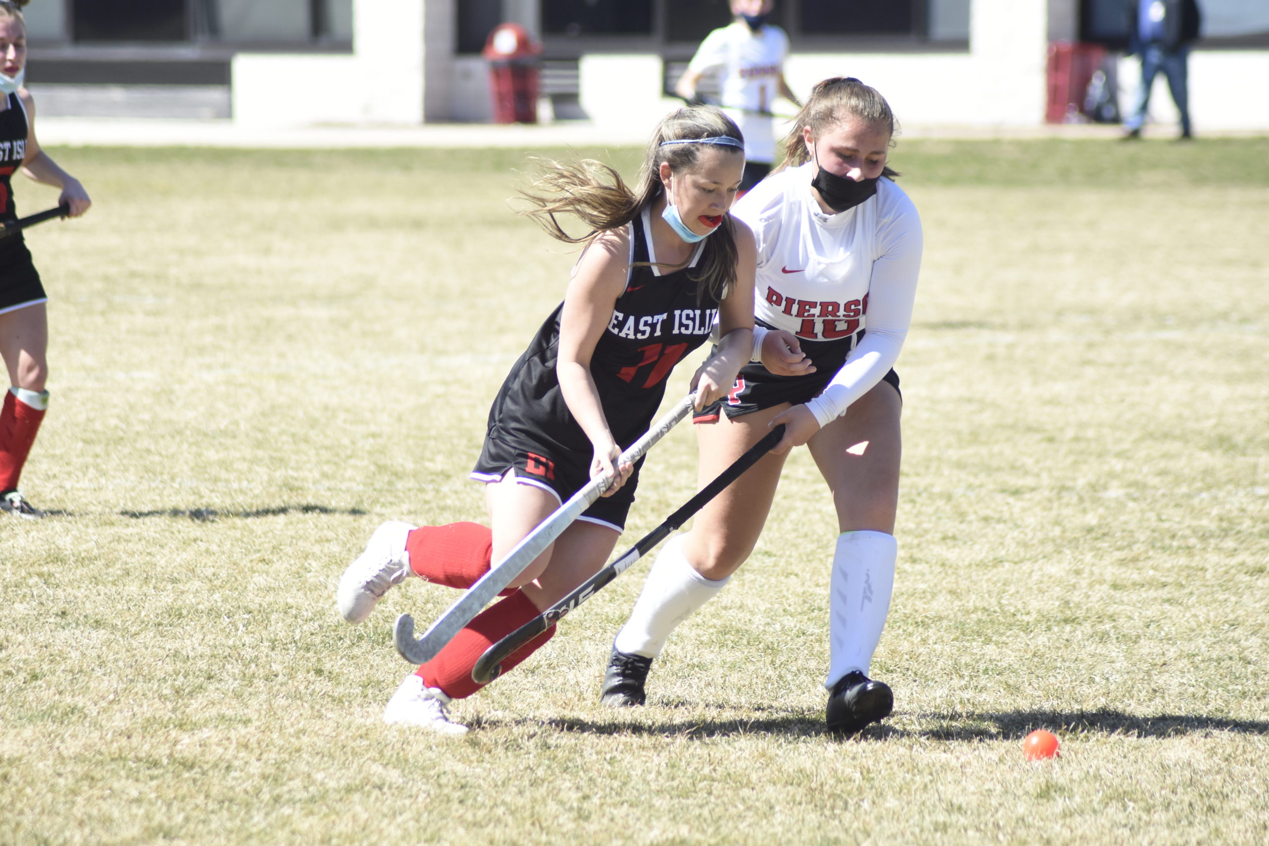 Pierson junior Micky Wilson sticks to an East Islip player.