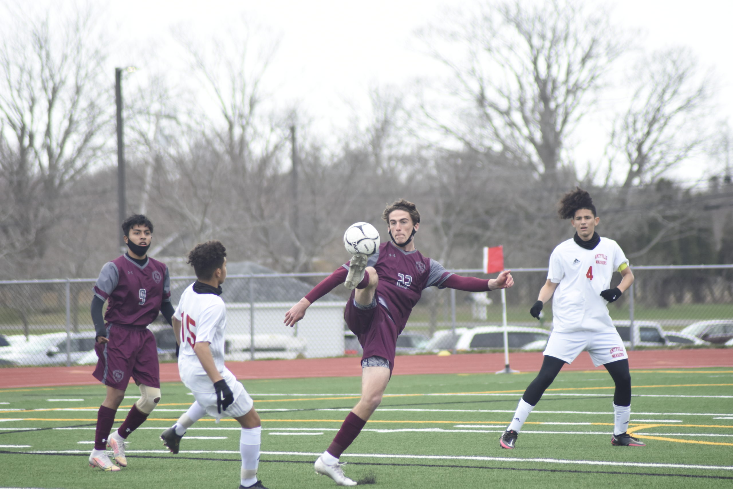 East Hampton senior Hudson Musnicki boots the ball.