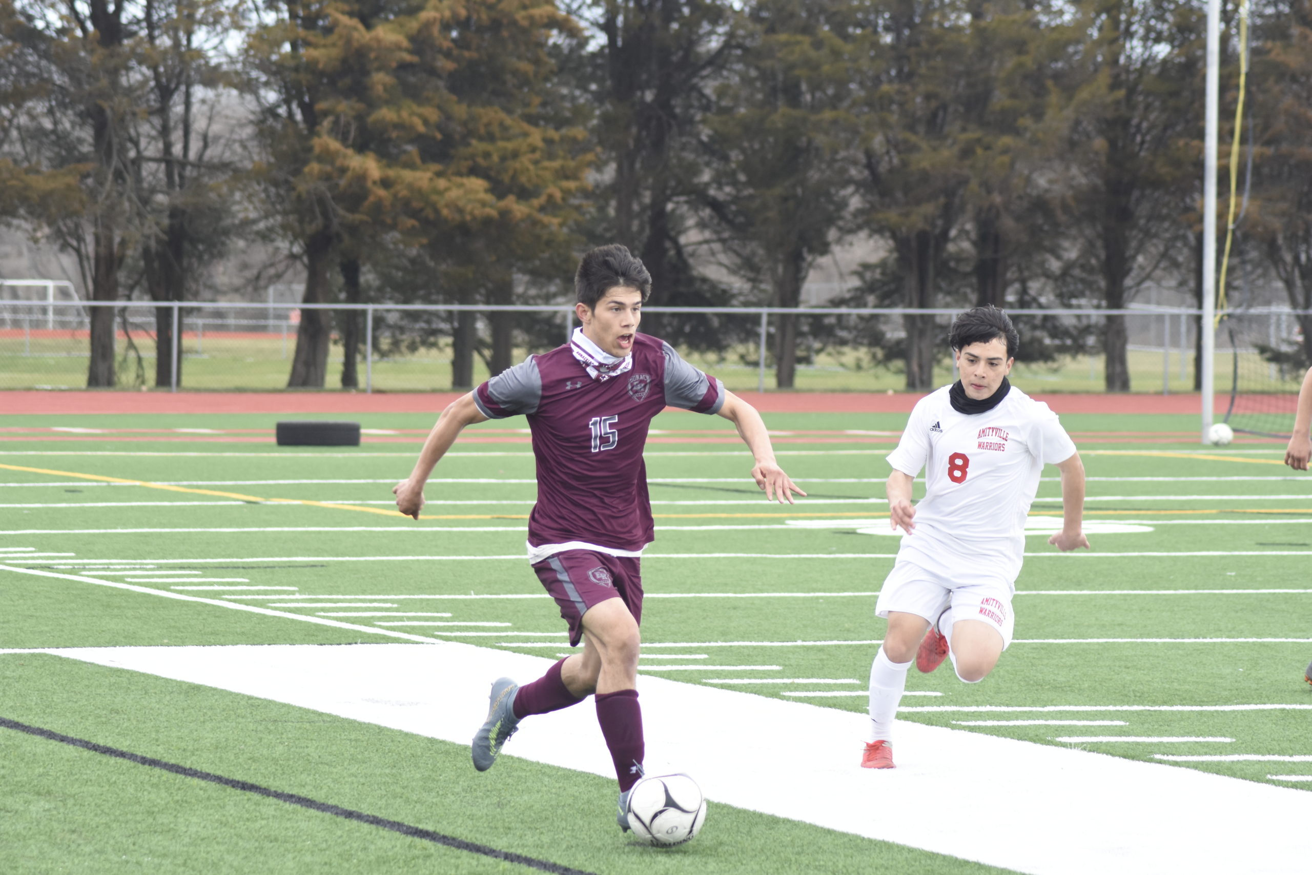 East Hampton senior forward Alex Vanegas looks for an open teammate upfield.