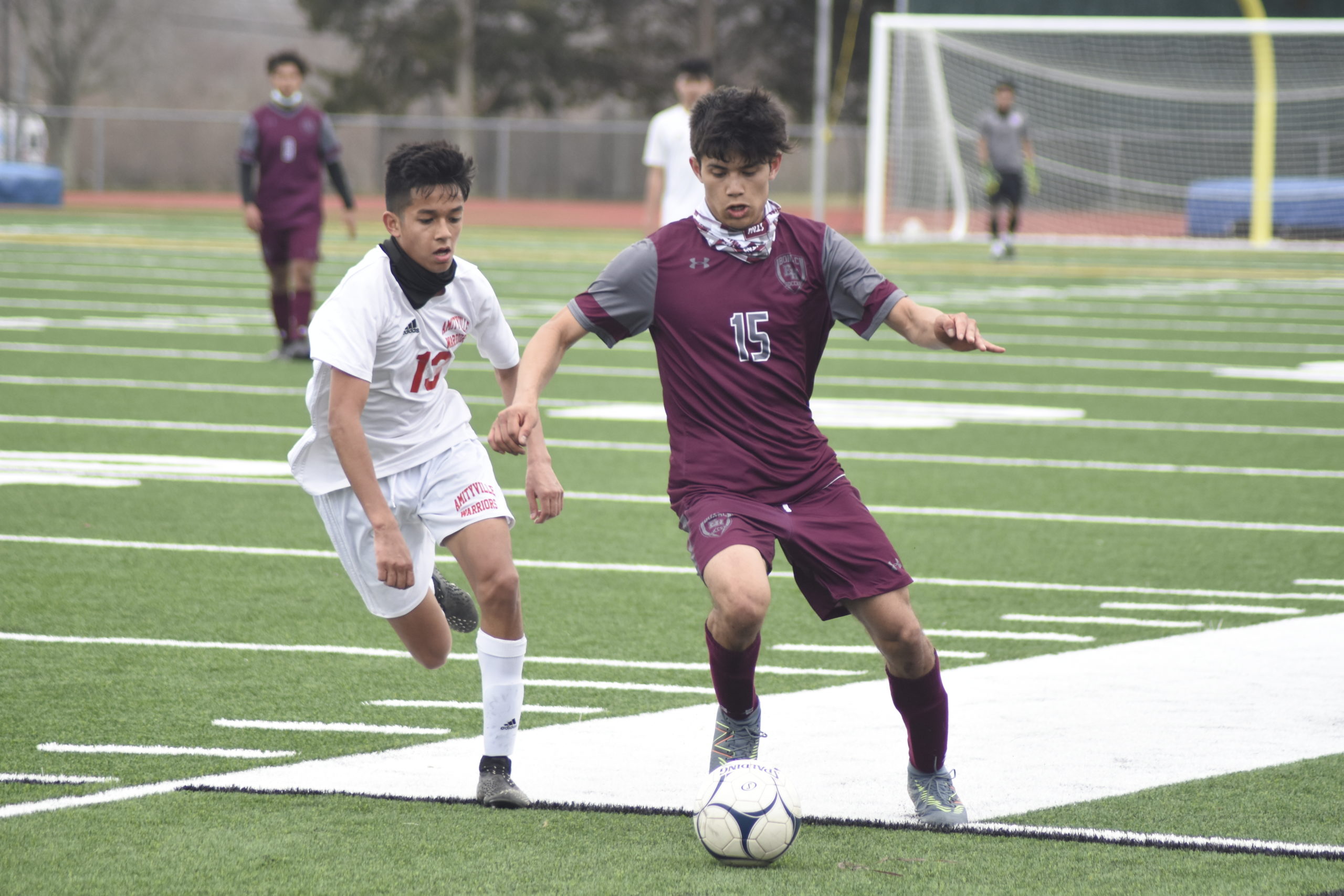 Senior Bonacker Alex Vanegas plays the ball down the sideline.