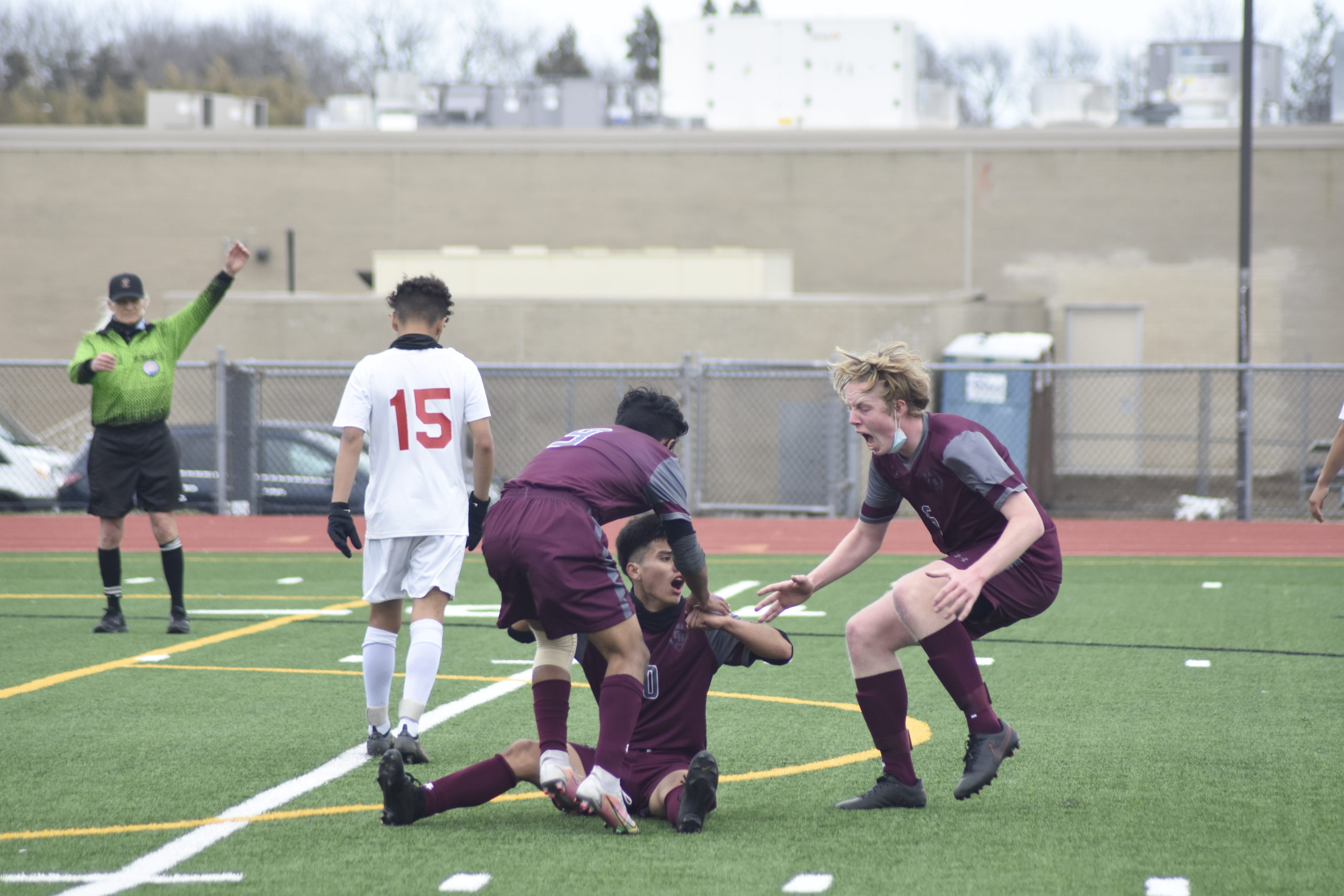 Eric Armijos and Matthew McGovern race to mob teammate Christopher Pintado after he scored the eventual game-winner with just over 25 minutes remaining in Wednesday's game.