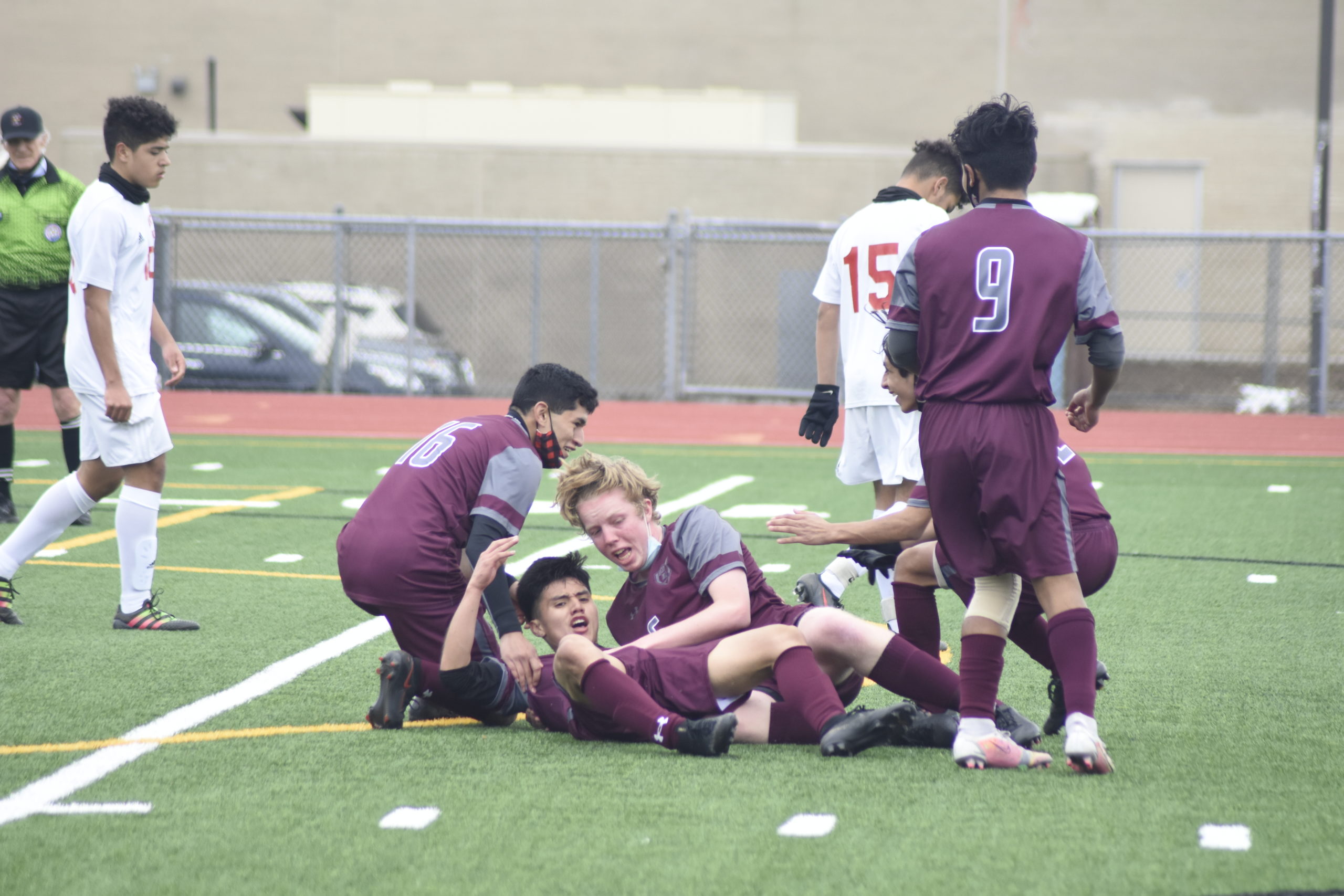 Bonackers mob and help up Christopher Pintado after he scored what was the game-winning goal on Wednesday.