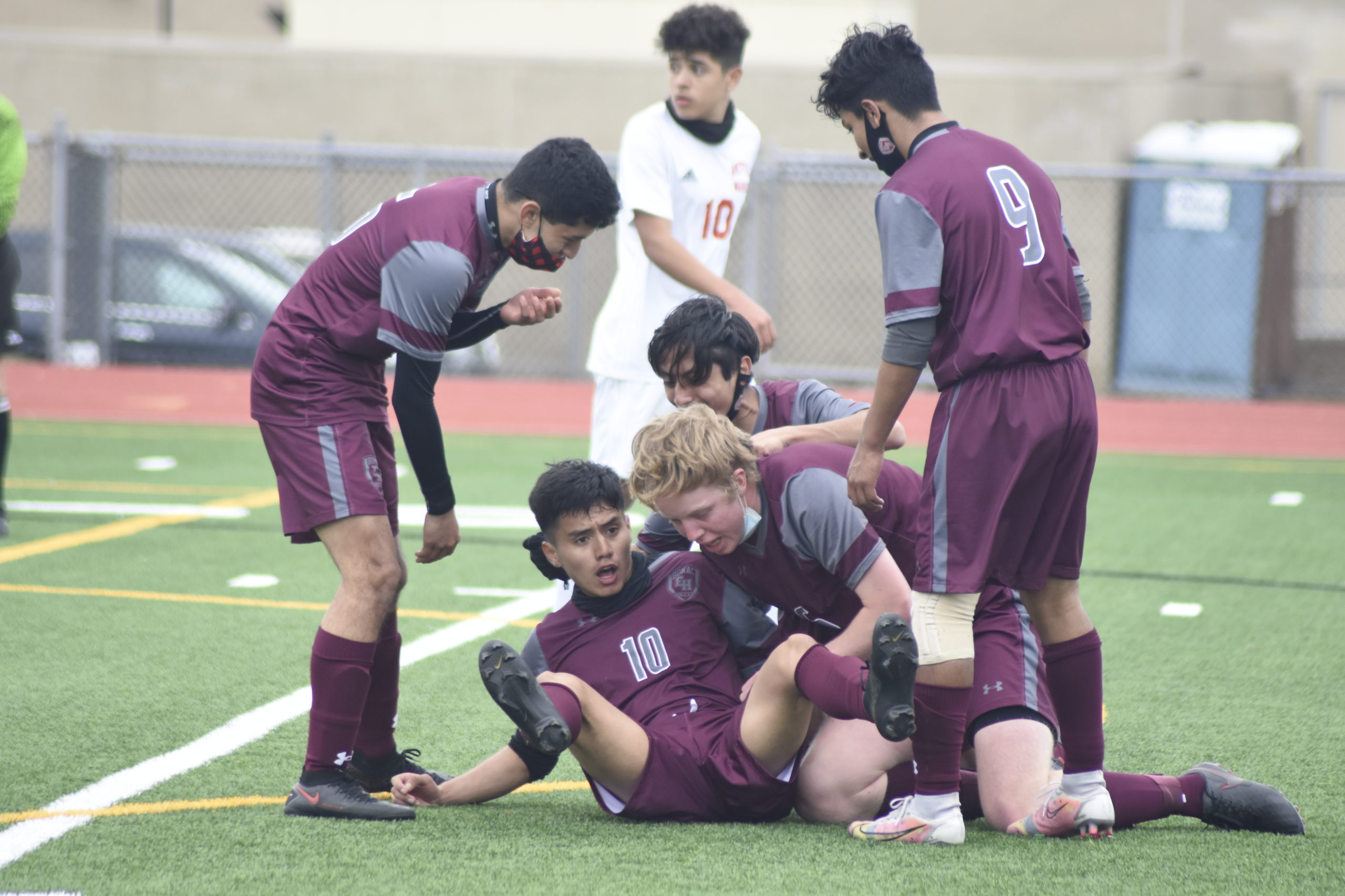 Bonackers mob and help up Christopher Pintado after he scored what was the game-winning goal on Wednesday.