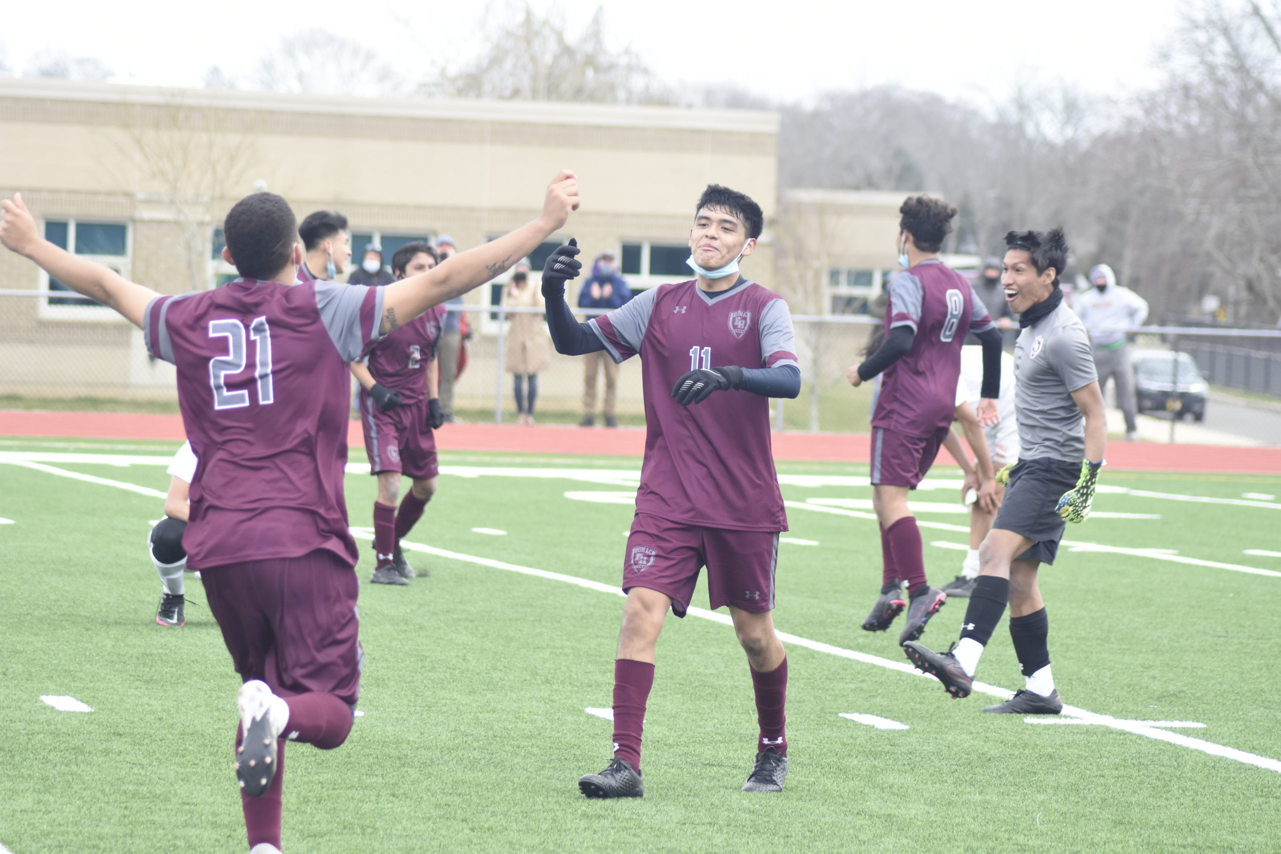 The Bonackers, including David Ayala (11) and Manuel Ruiz, celebrate a 1-0 victory over Amityville.