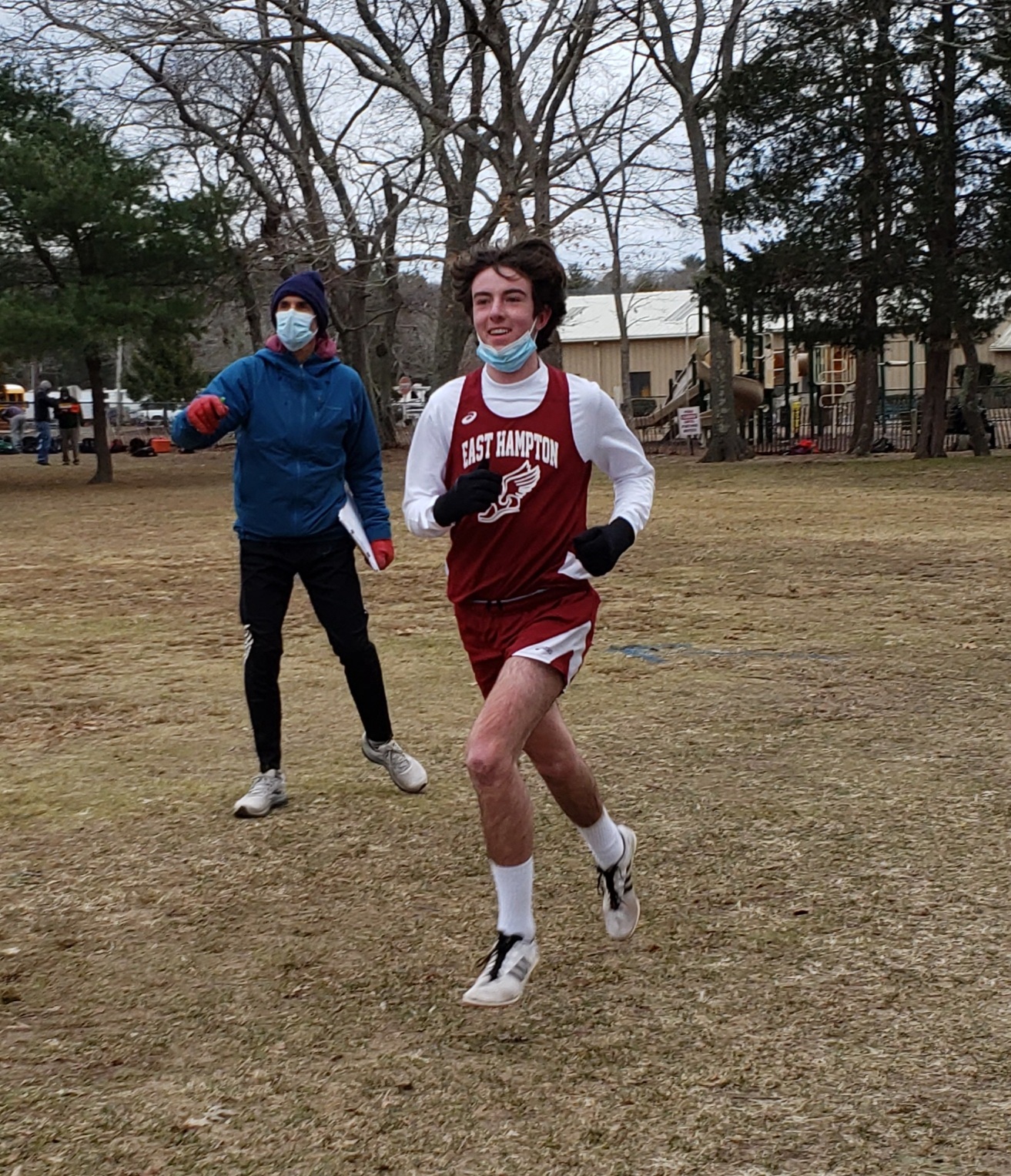 East Hampton assistant coach Paul Hamilton directs Liam Fowkes.