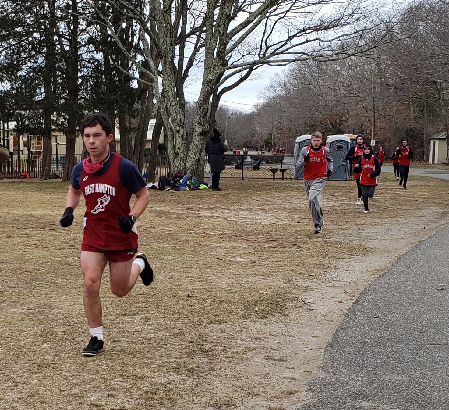 East Hampton senior captain Manny Vilar leads a pack of runners.