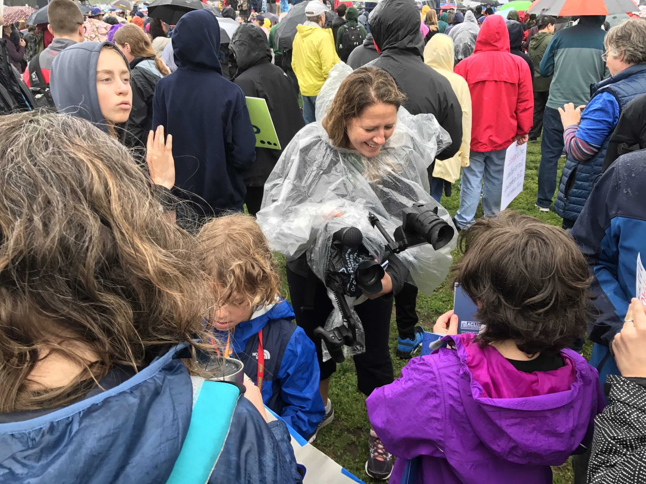 Christi Cooper filming at a science march.