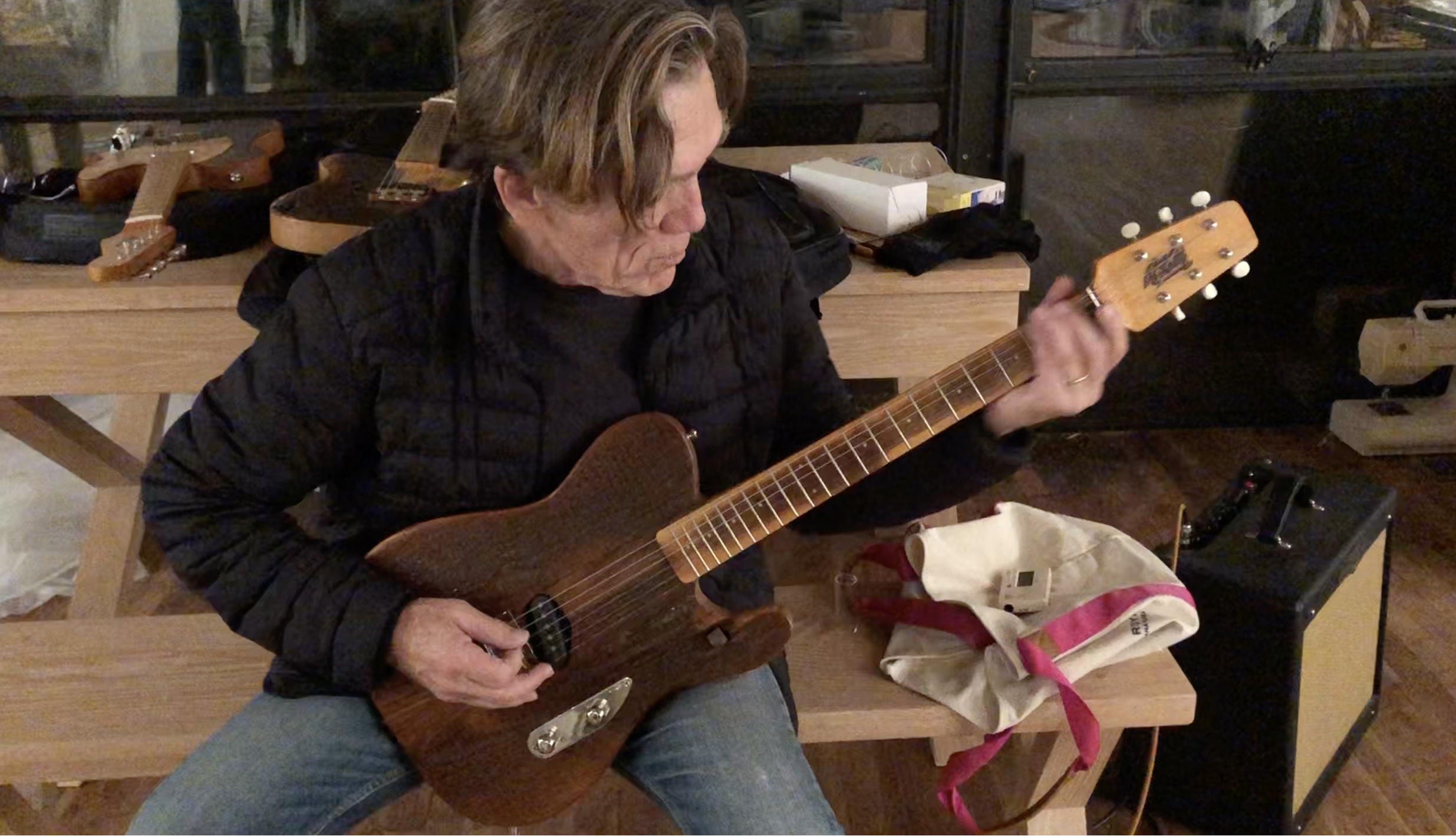 G.E. Smith trying out one of The Church guitars.