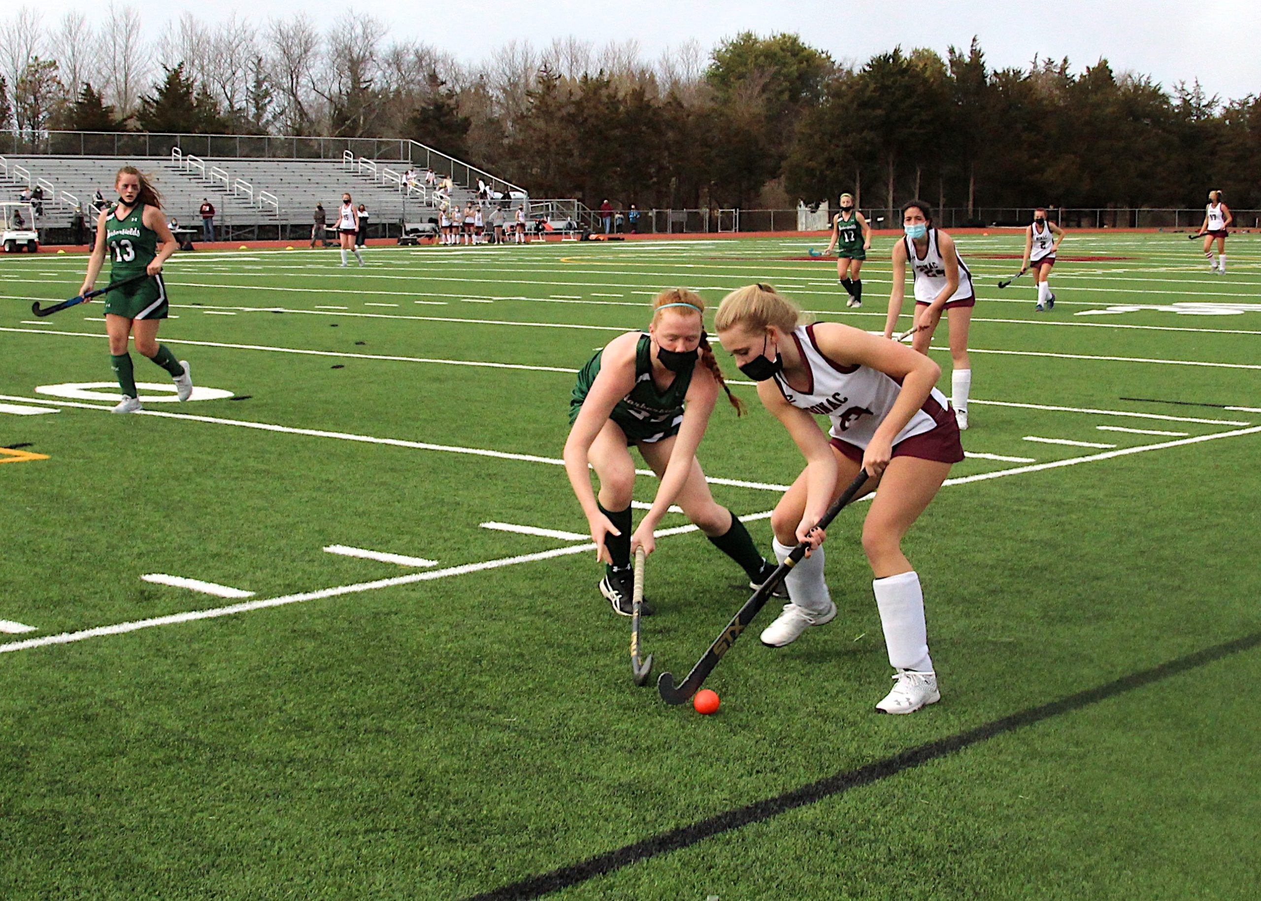 East Hampton junior Hanna Medler keeps the ball away from a Harborfields player.