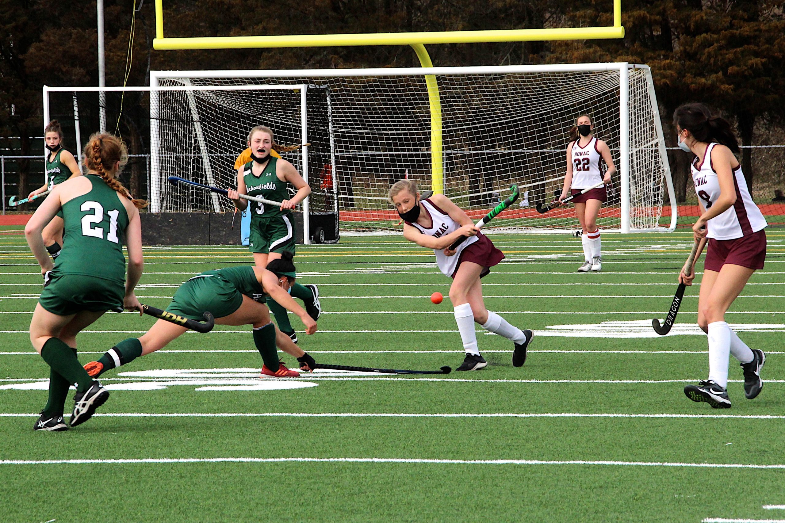 East Hampton sophomore Chloe Coleman tries to send the ball before a Harborfields player blocks it.