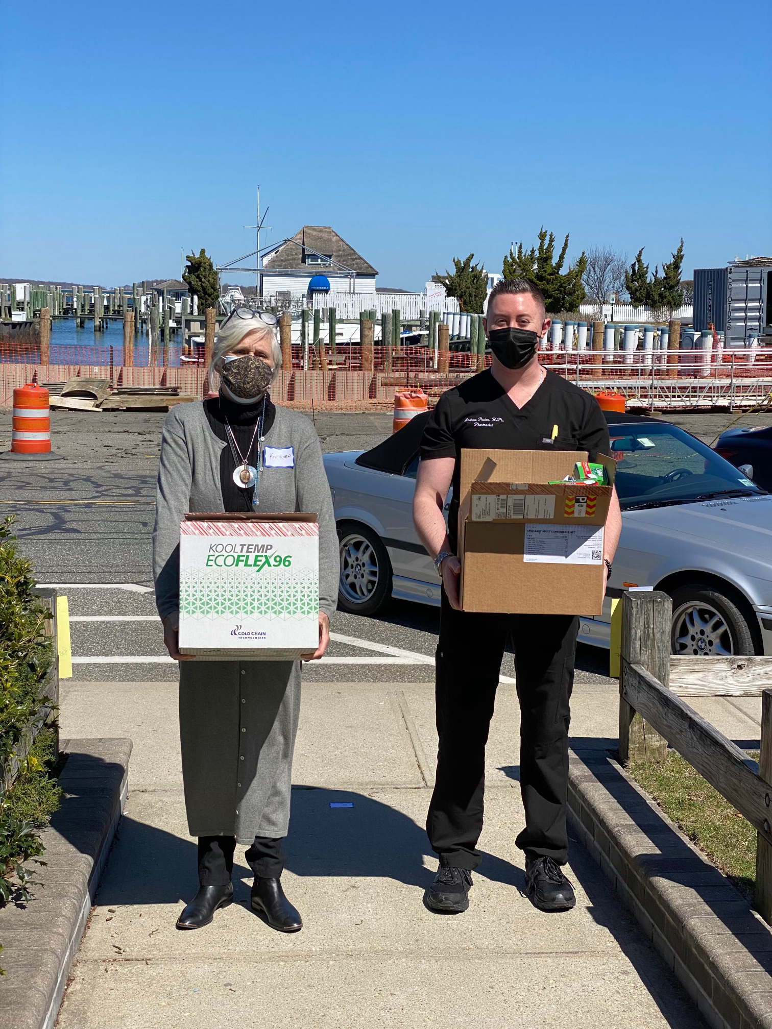 Sag Harbor Mayor Kathleen Mulcahy and White's Apothecary pharmacist Andrew Poster deliver a load of COVID-19 boxes to a popup vaccination site at the American Legion hall in Sag Harbor.