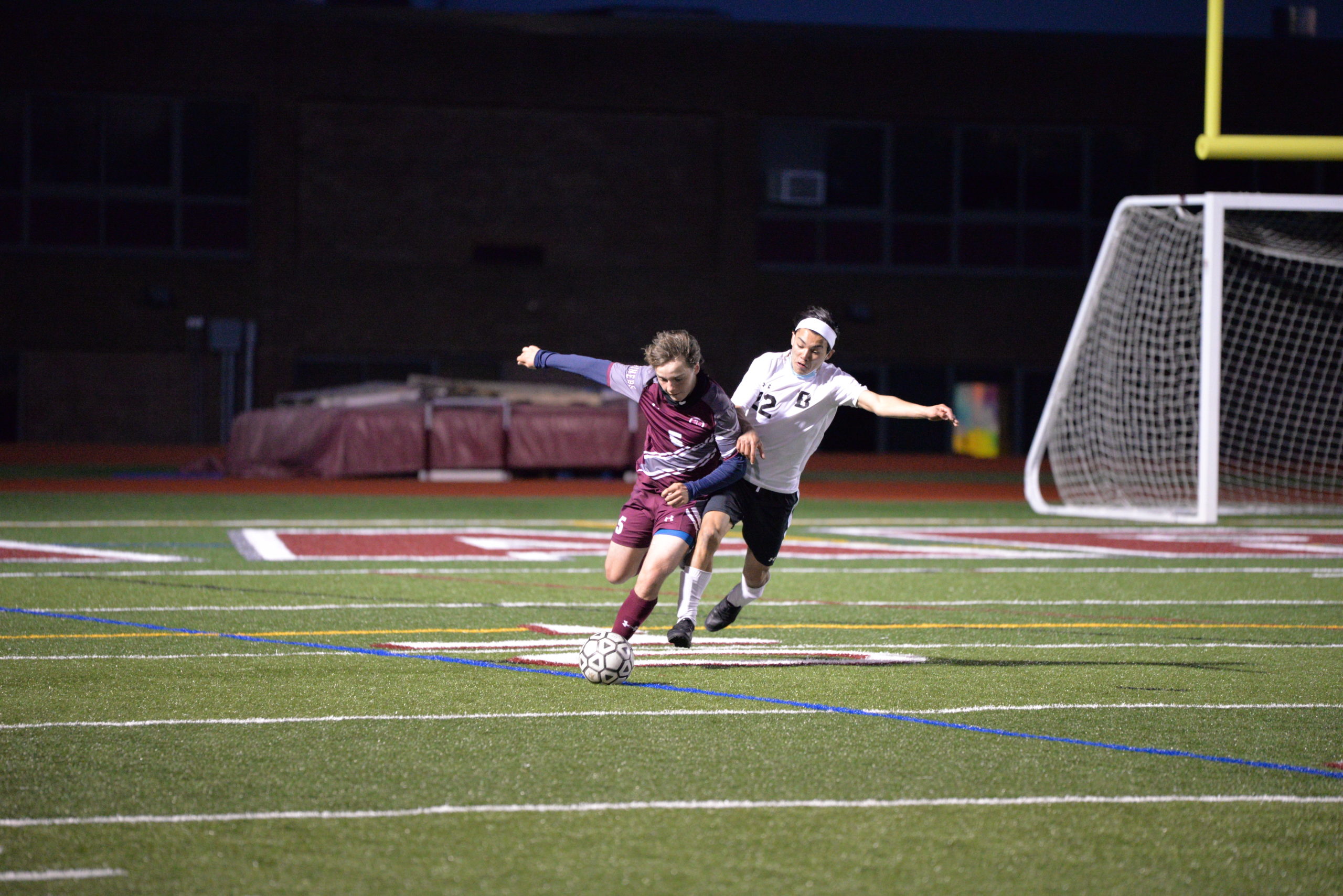 Mariner Mason Stevens fends off a Babylon player.