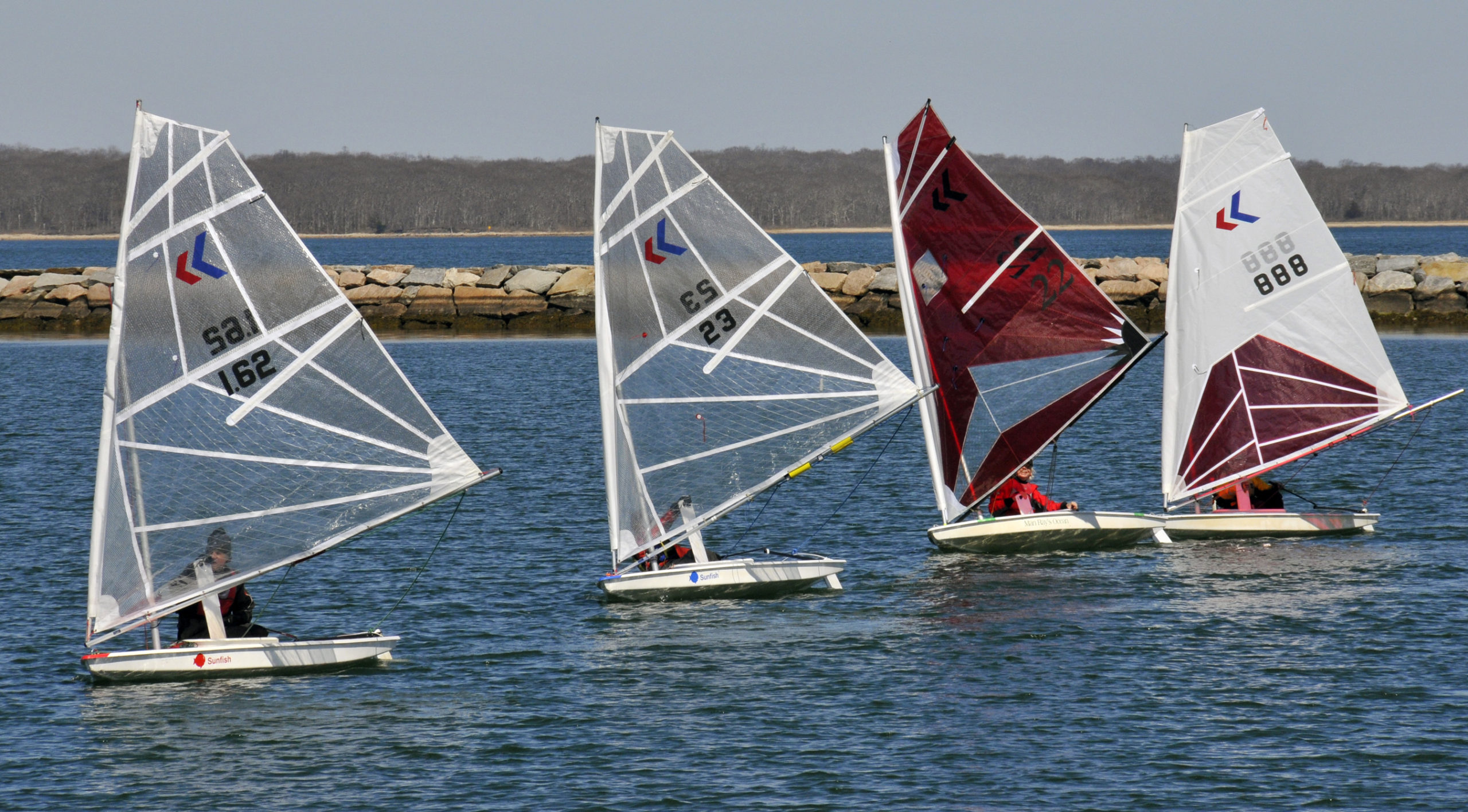 Nick Gazzolo, left, Gloria Maroti Frazee, and Scott and Julian Shapiro on a down wind reach.