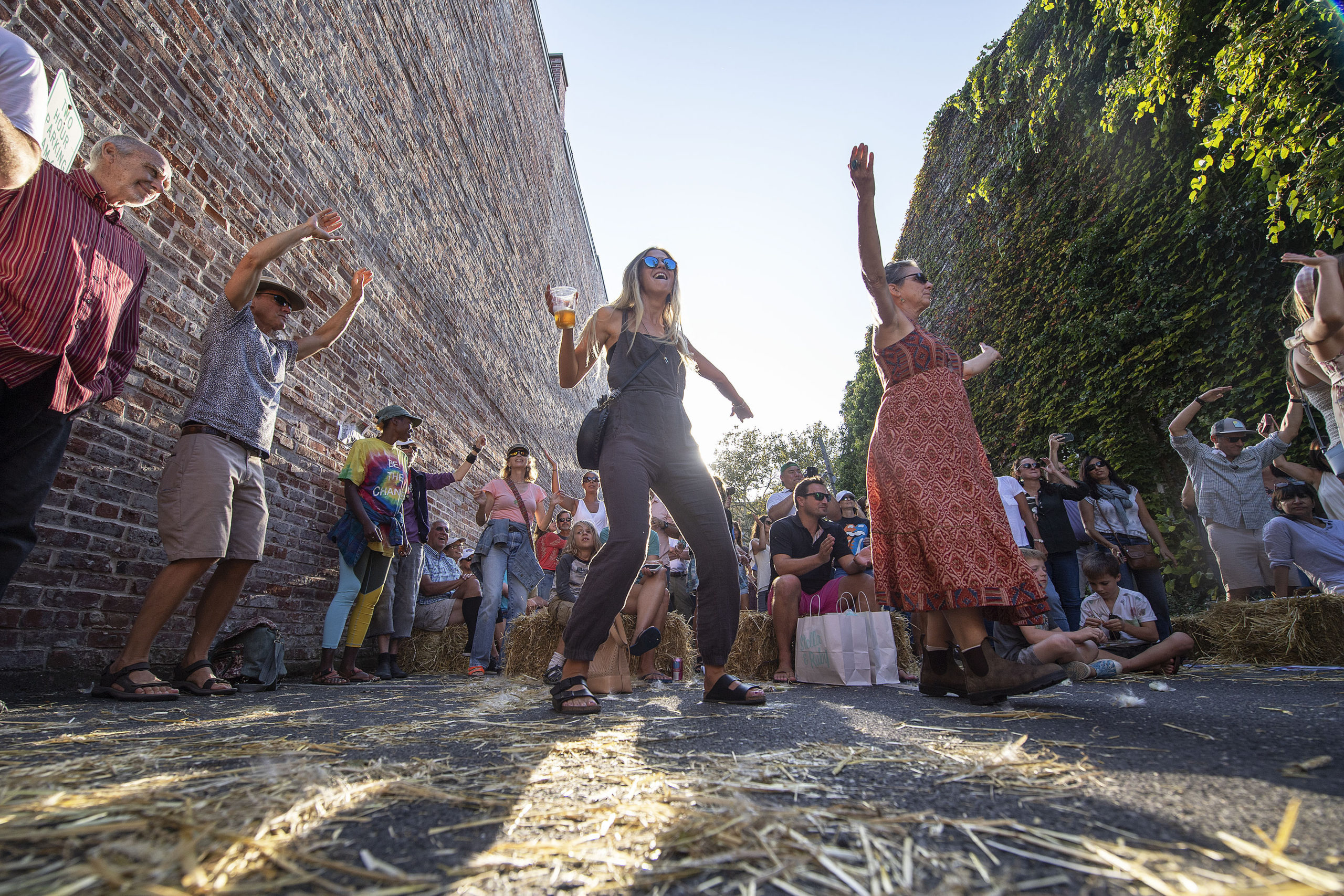 Dancing in the alley by the Jackson Dodds stage during the 9th Annual Sag Harbor American Music Festival in Sag Harbor in September 2019.  MICHAEL HELLER