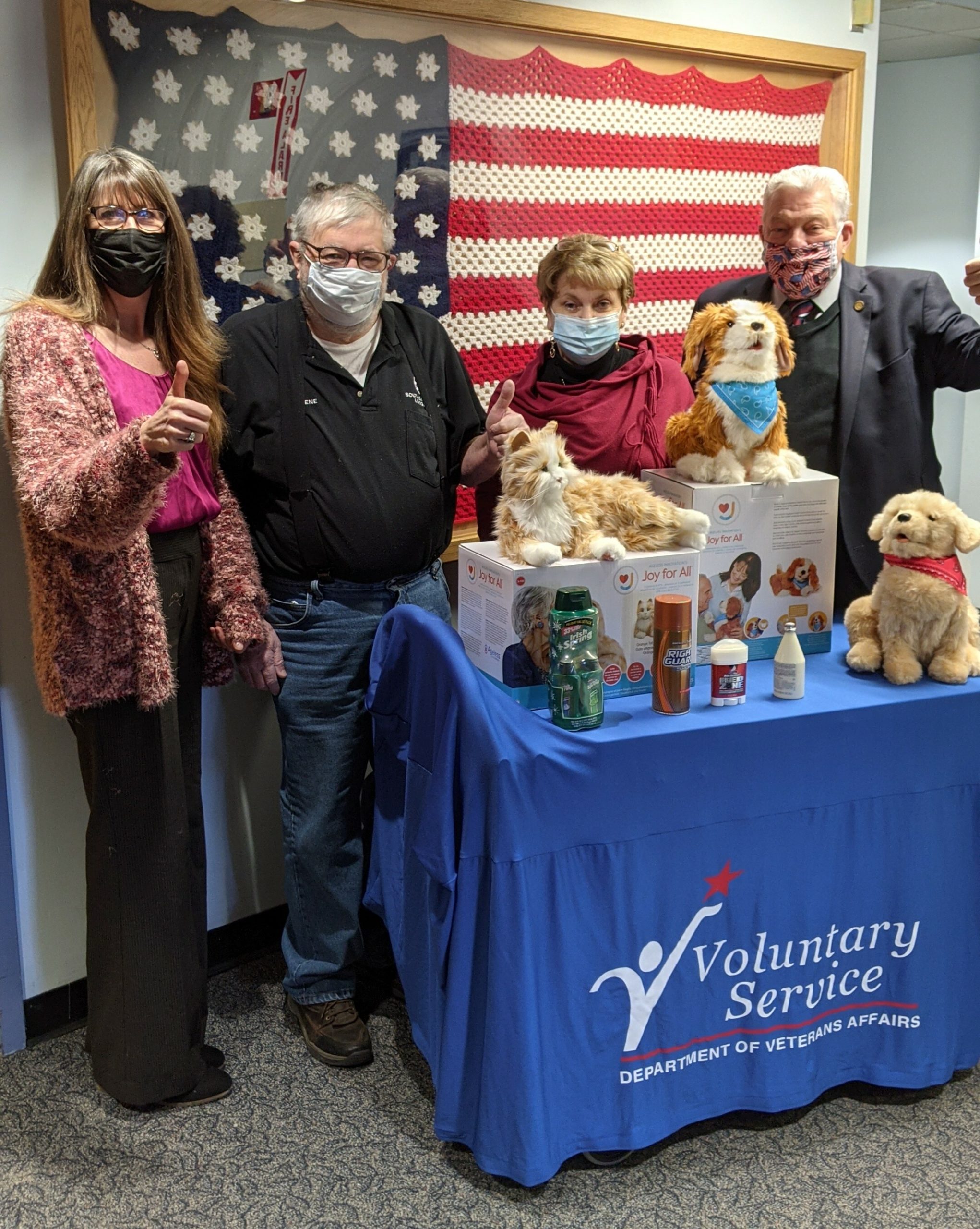 Northport Veterans Hospital Volunteer Service Representative Jennifer Pohl, with Gene Scanlon, Kathleen Miller and Northport Veterans Hospital Chief of Volunteer Services Richard Kitson at the hospital on March 5. Leading Knight, Ms. Miller and Lodge Secretary, Mr. Scanlon brought to the Northport Veterans Hospital six robotic dogs, three robotic cats, extra batteries and assorted magazines collected by the Southampton Elks Lodge #1574.   These robotic animals will be used by veterans suffering from dementia and Alzheimer's Disease.