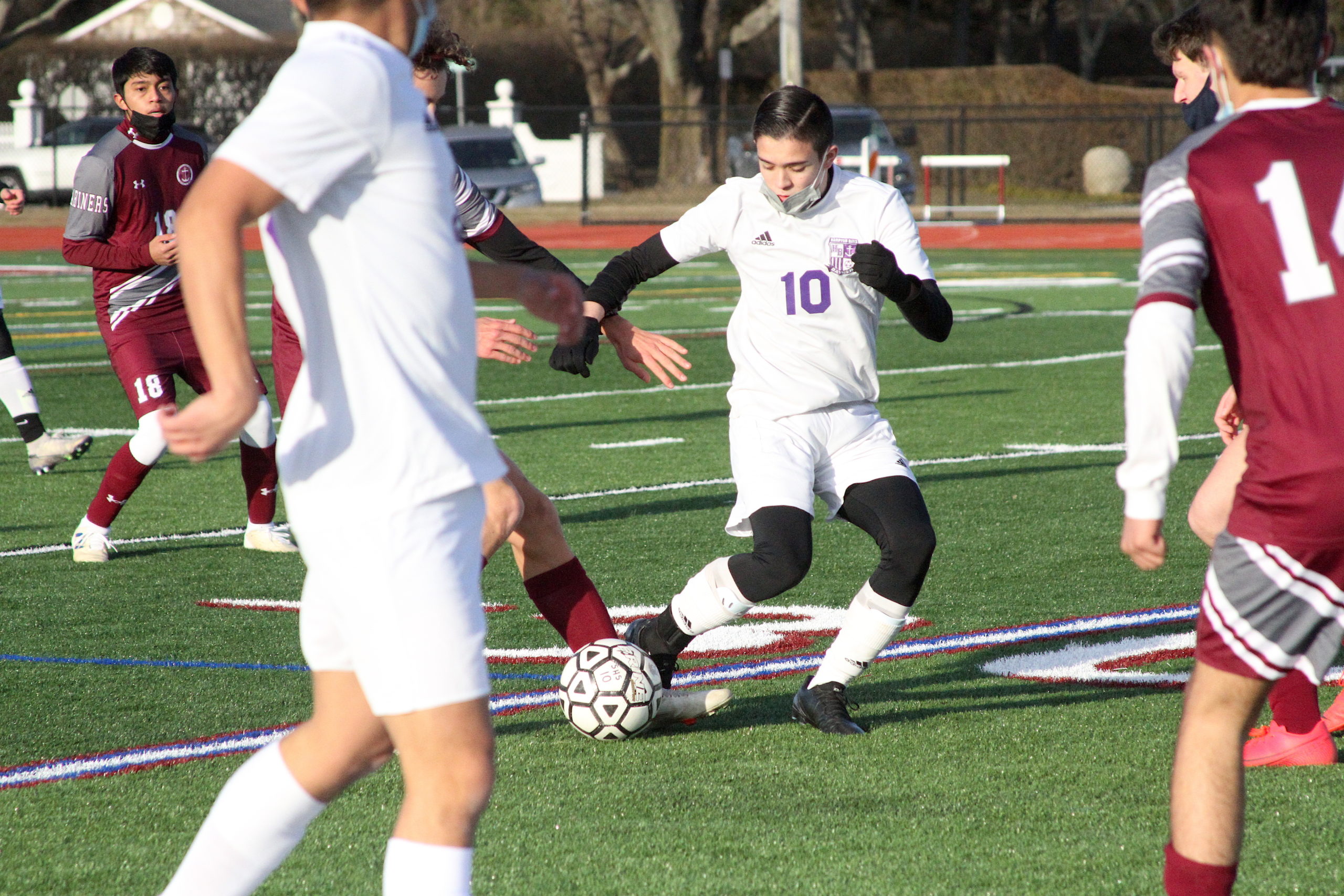 Hampton Bays junior Justin Jimenez fights for possession of the ball.