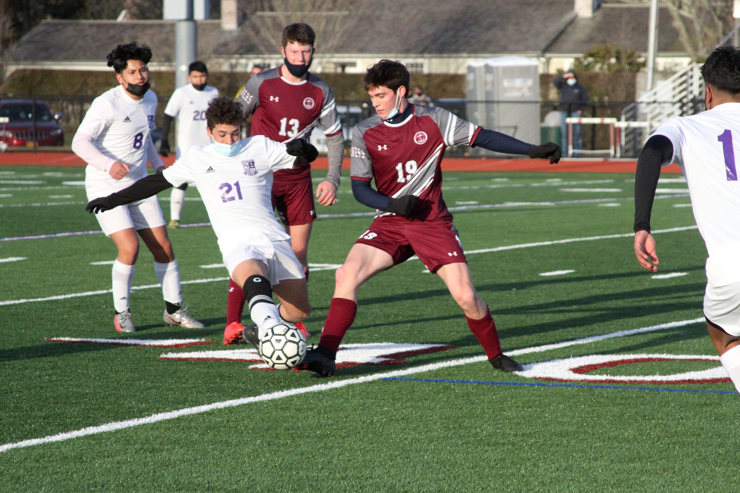 Hampton Bays senior defender Esteban Vasquez and Southampton junior forward Gavin Johnston battle for the ball.